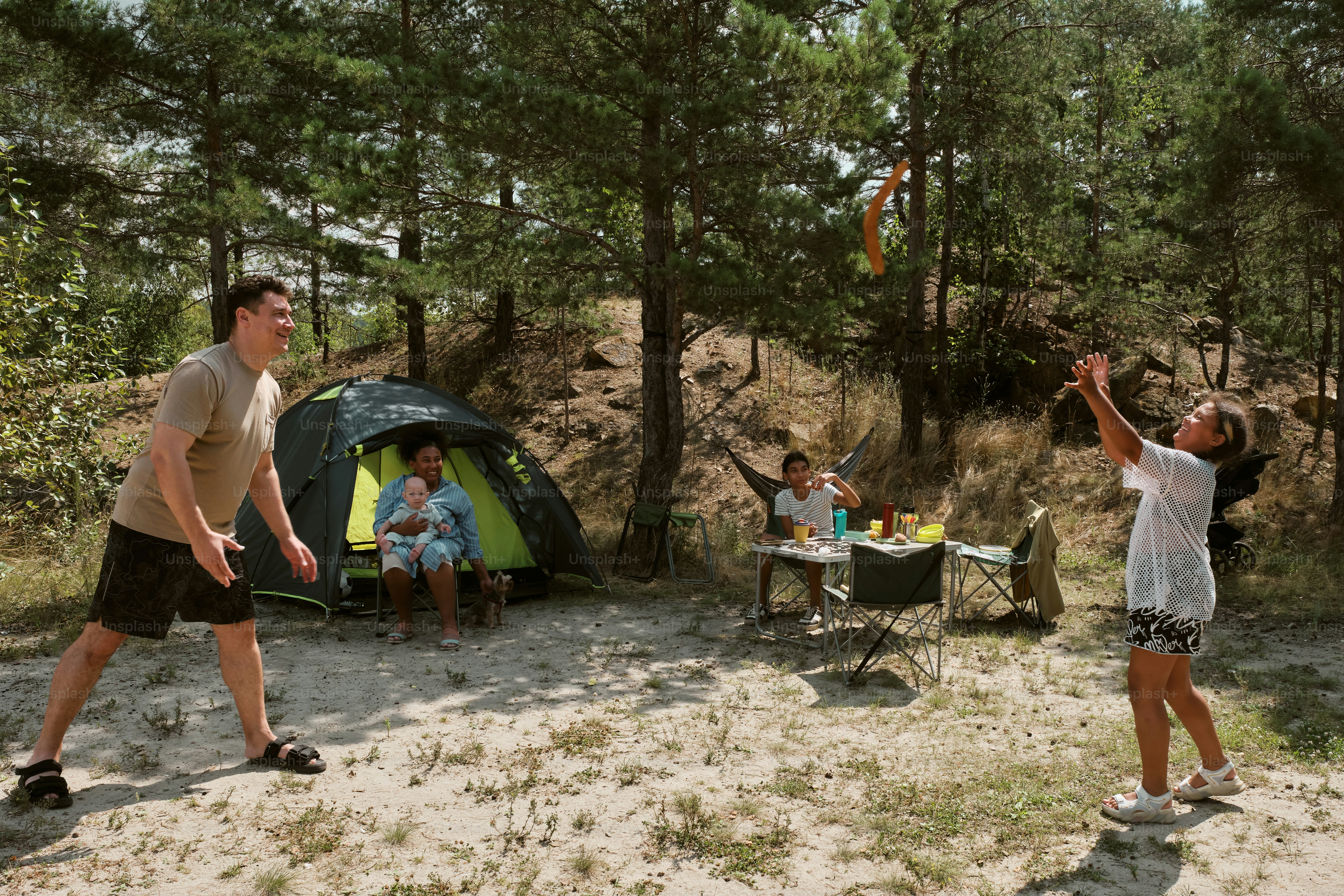 A group of people playing a game of frisbee