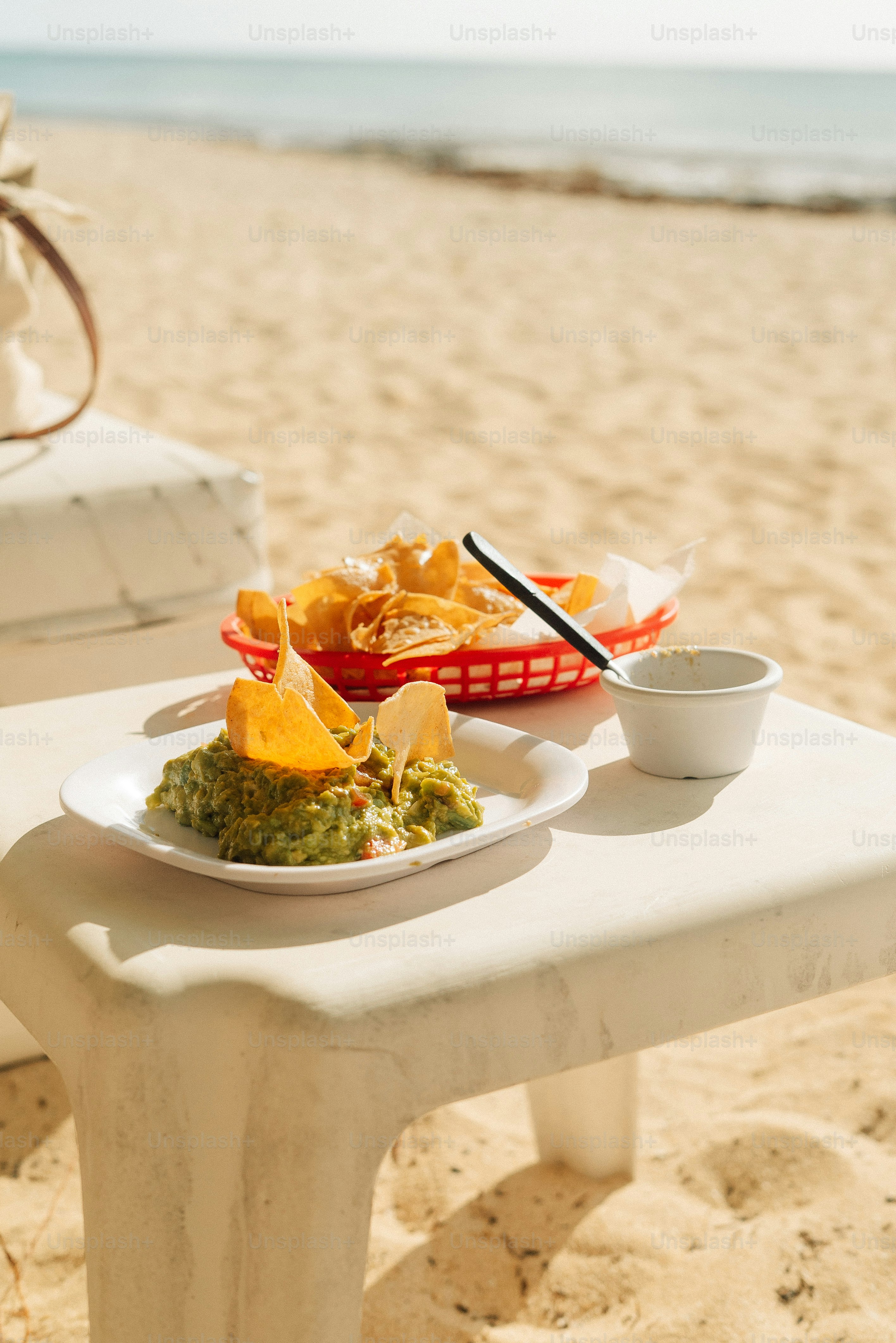 A plate of food sitting on top of a white bench