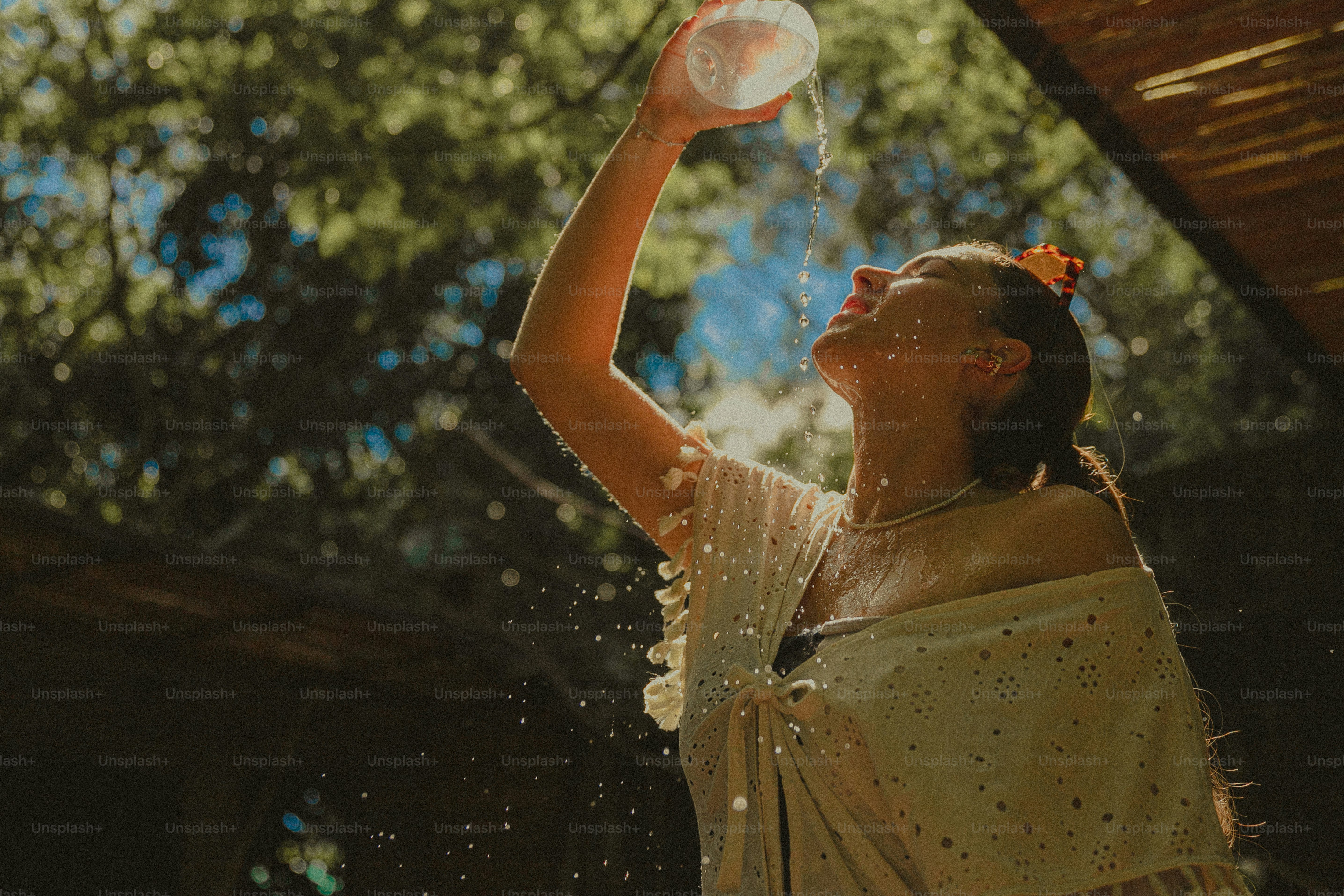 A woman in a white dress holding a white frisbee