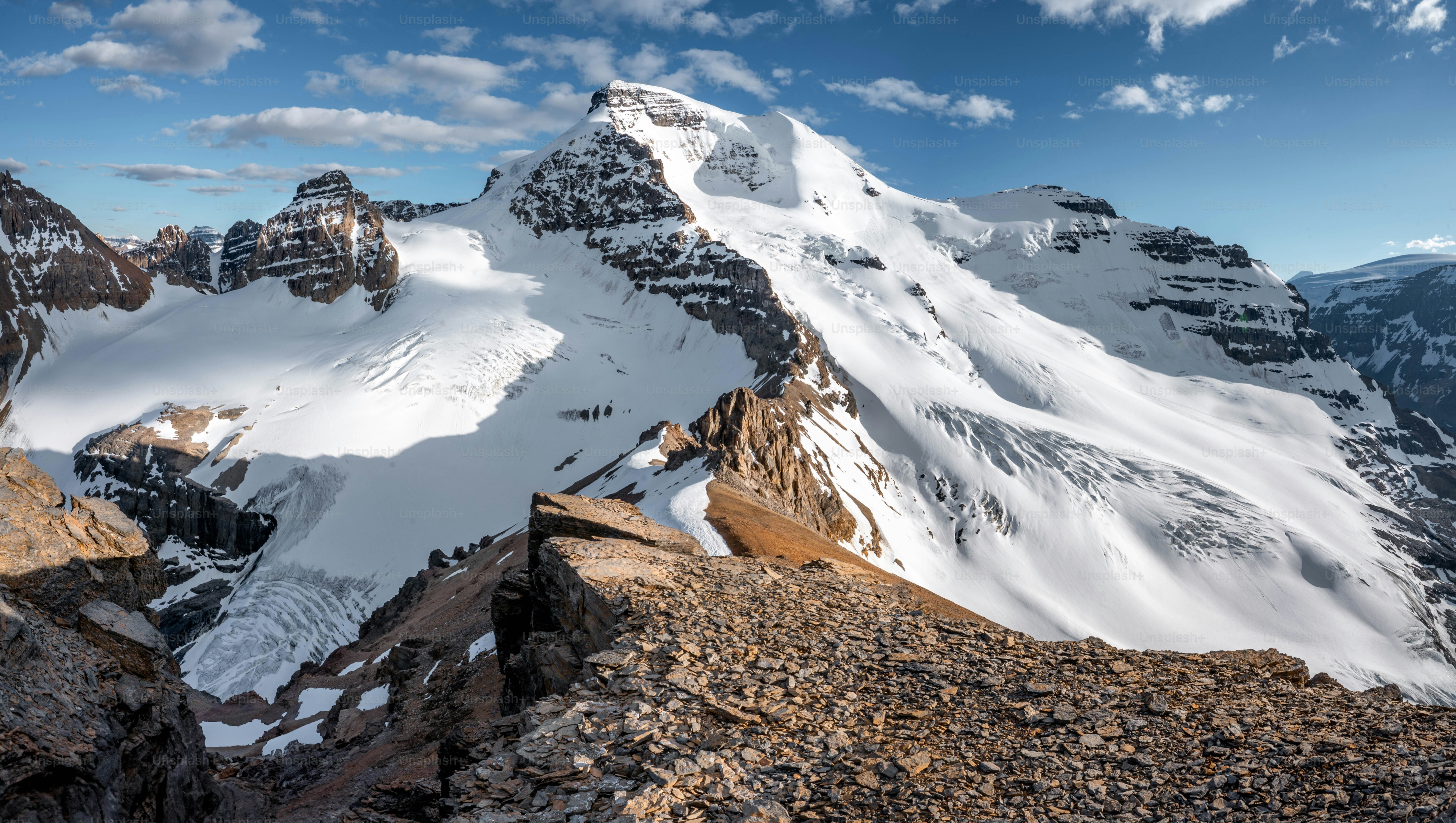 A snow covered mountain with a sky background