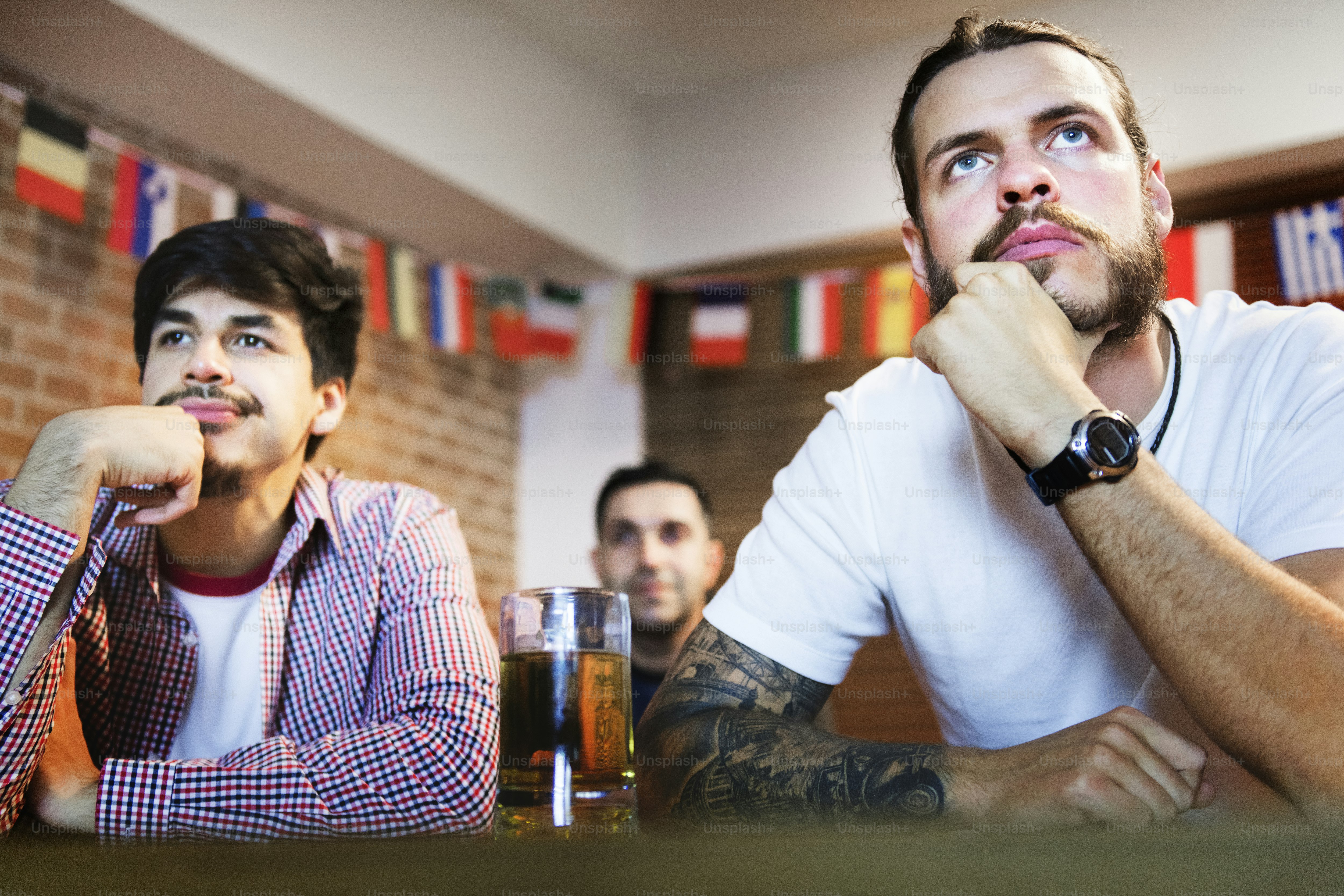 Friends cheering sport at bar together