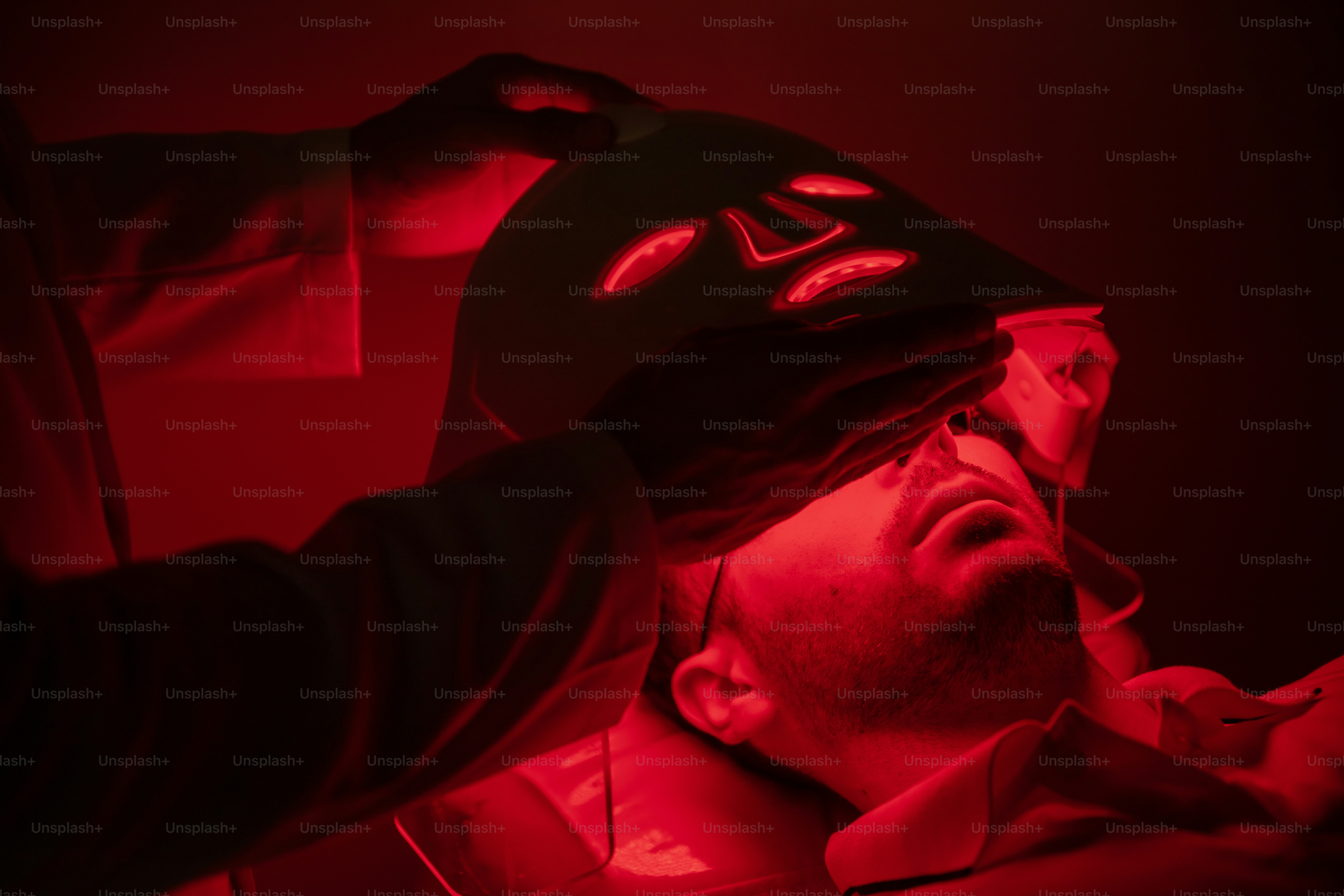 A man in a black hat and a red light photo – Self care Image on Unsplash
