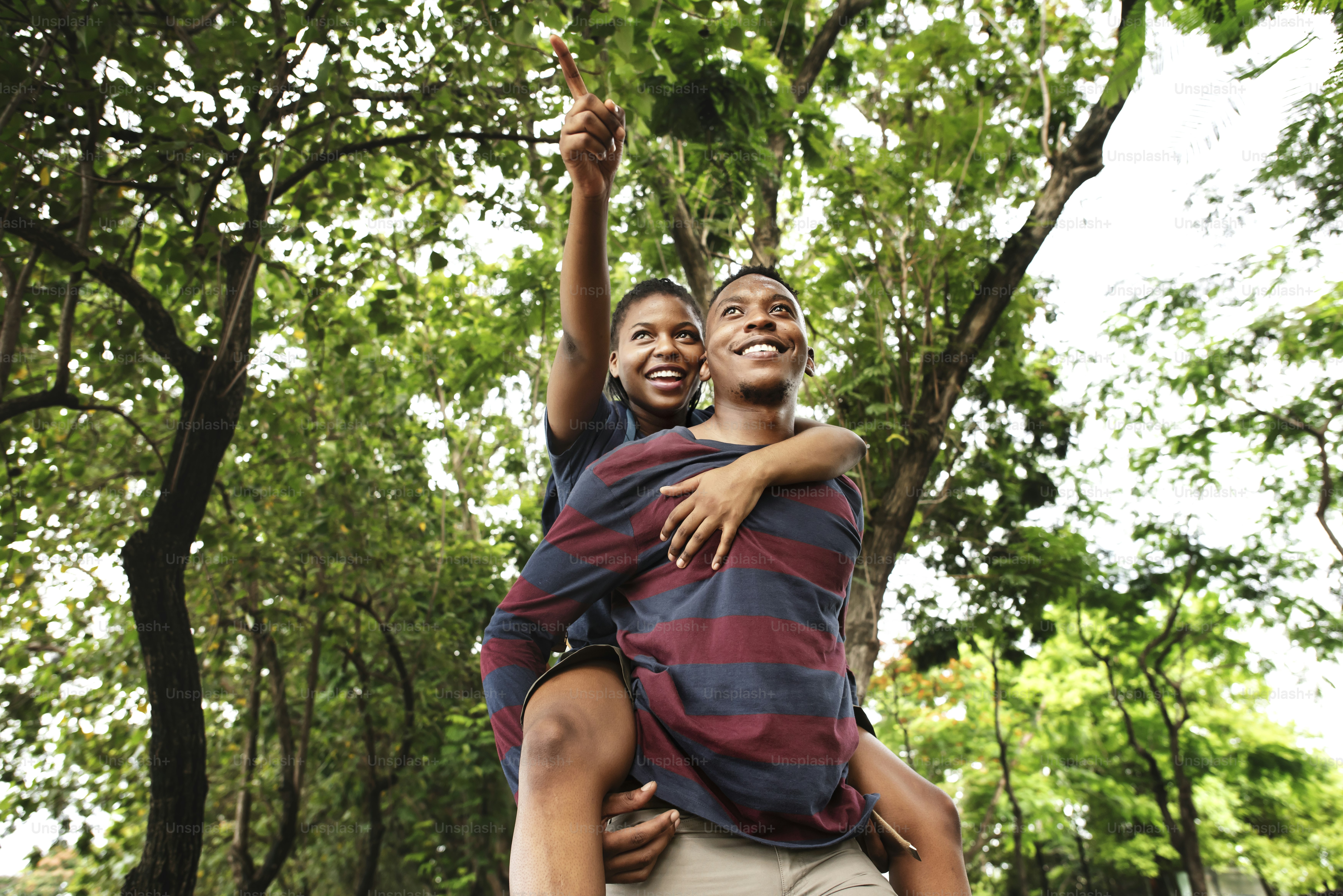 Man giving his girlfriend a piggyback ride