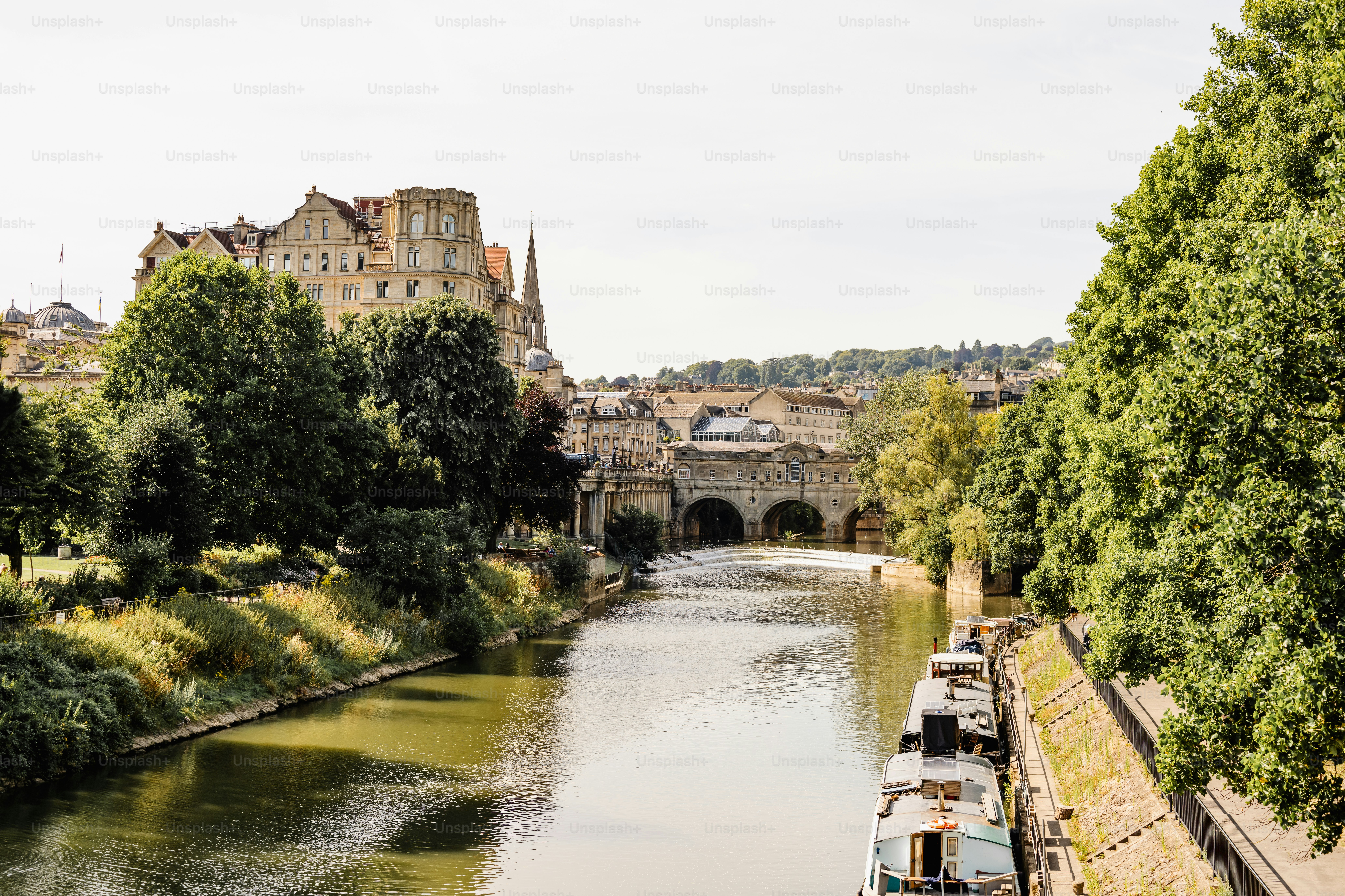 A river running through a lush green countryside