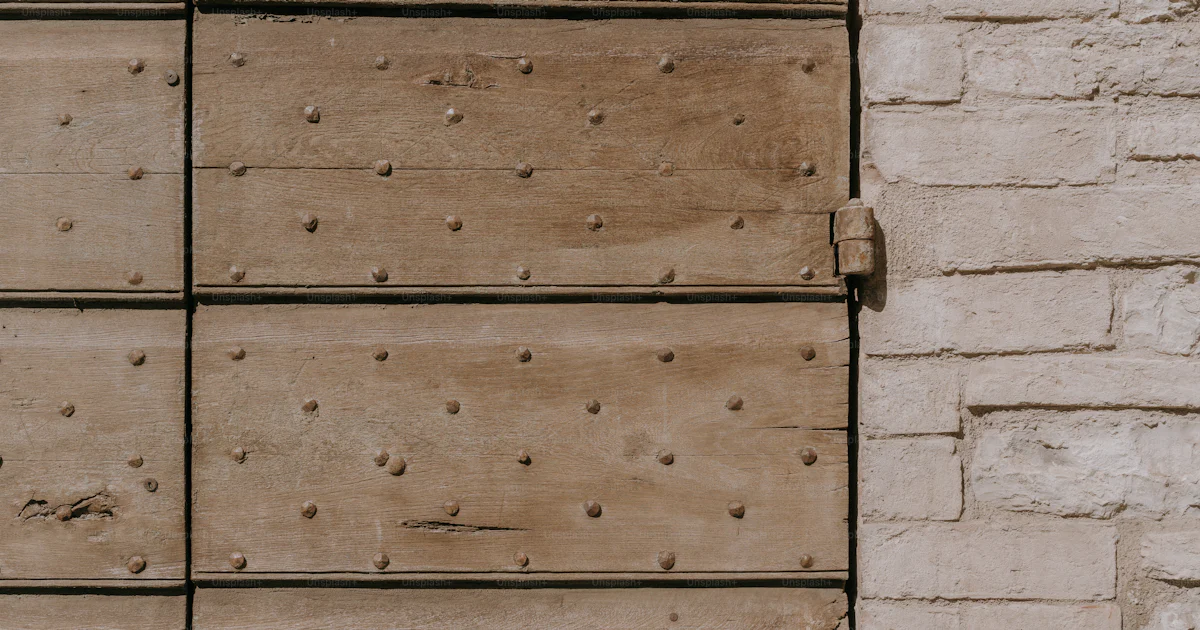 A white brick wall with holes in it photo – Wood Image on Unsplash