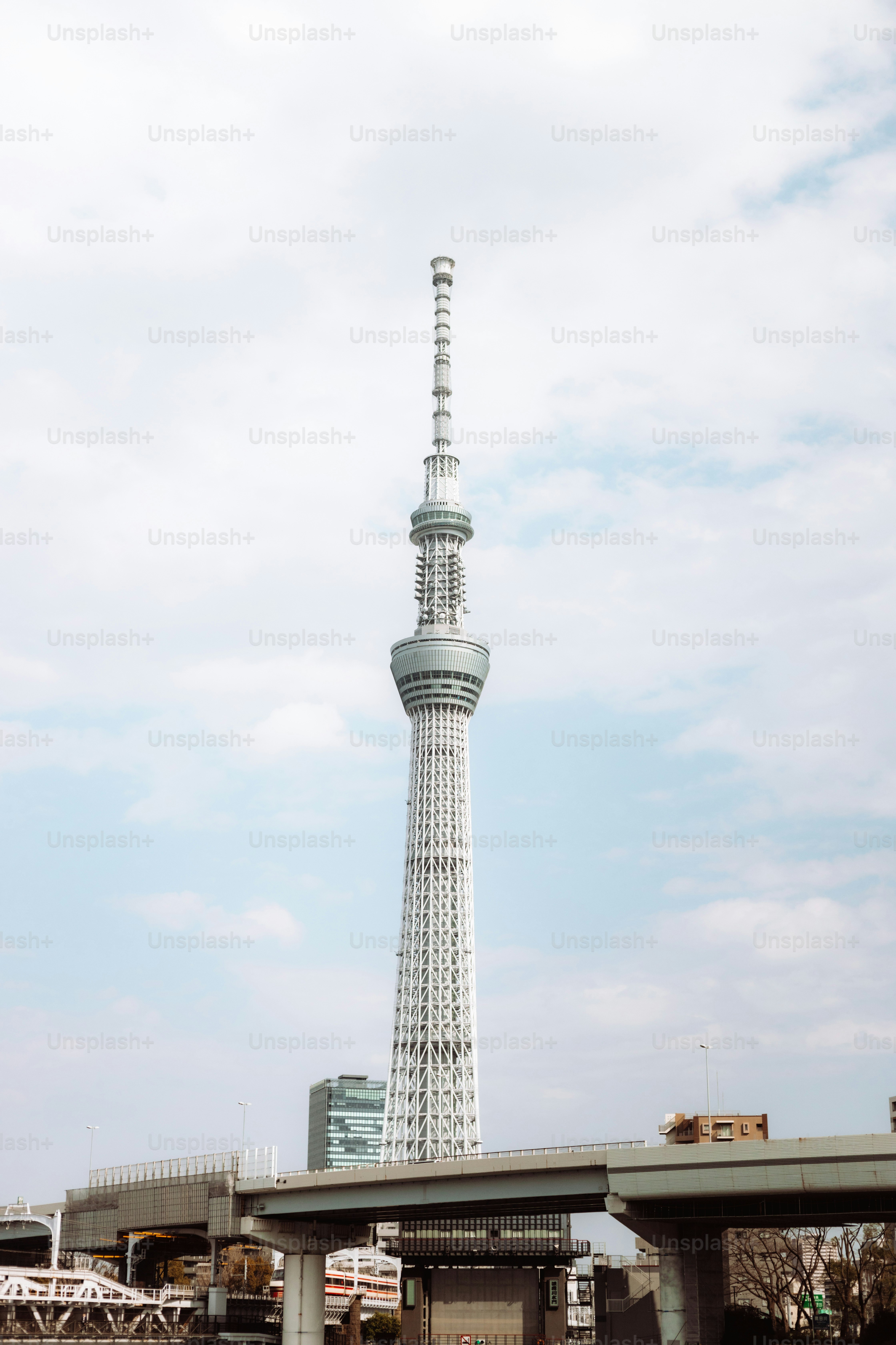 A tall white tower towering over a city