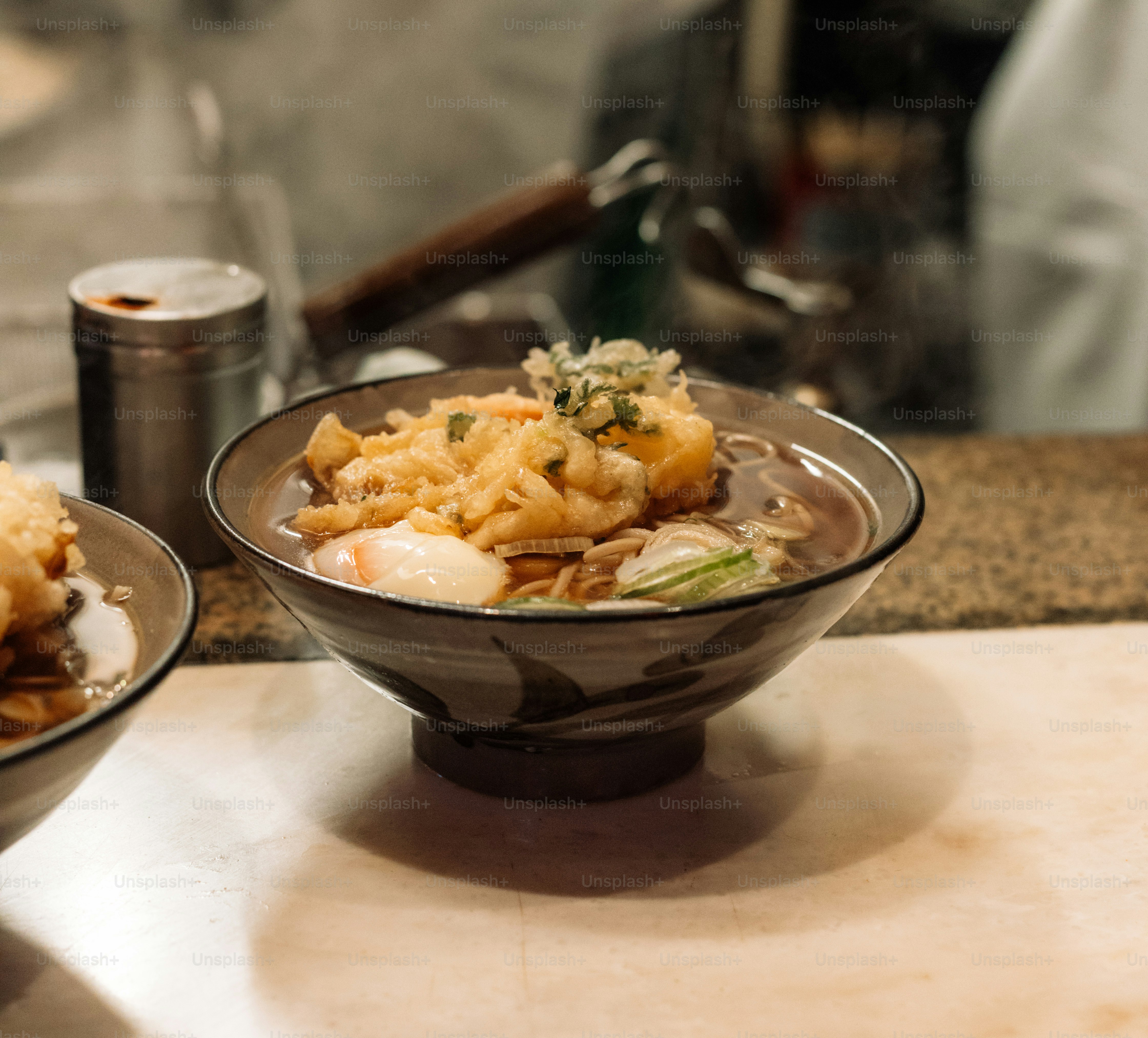 A couple of bowls of food on a table