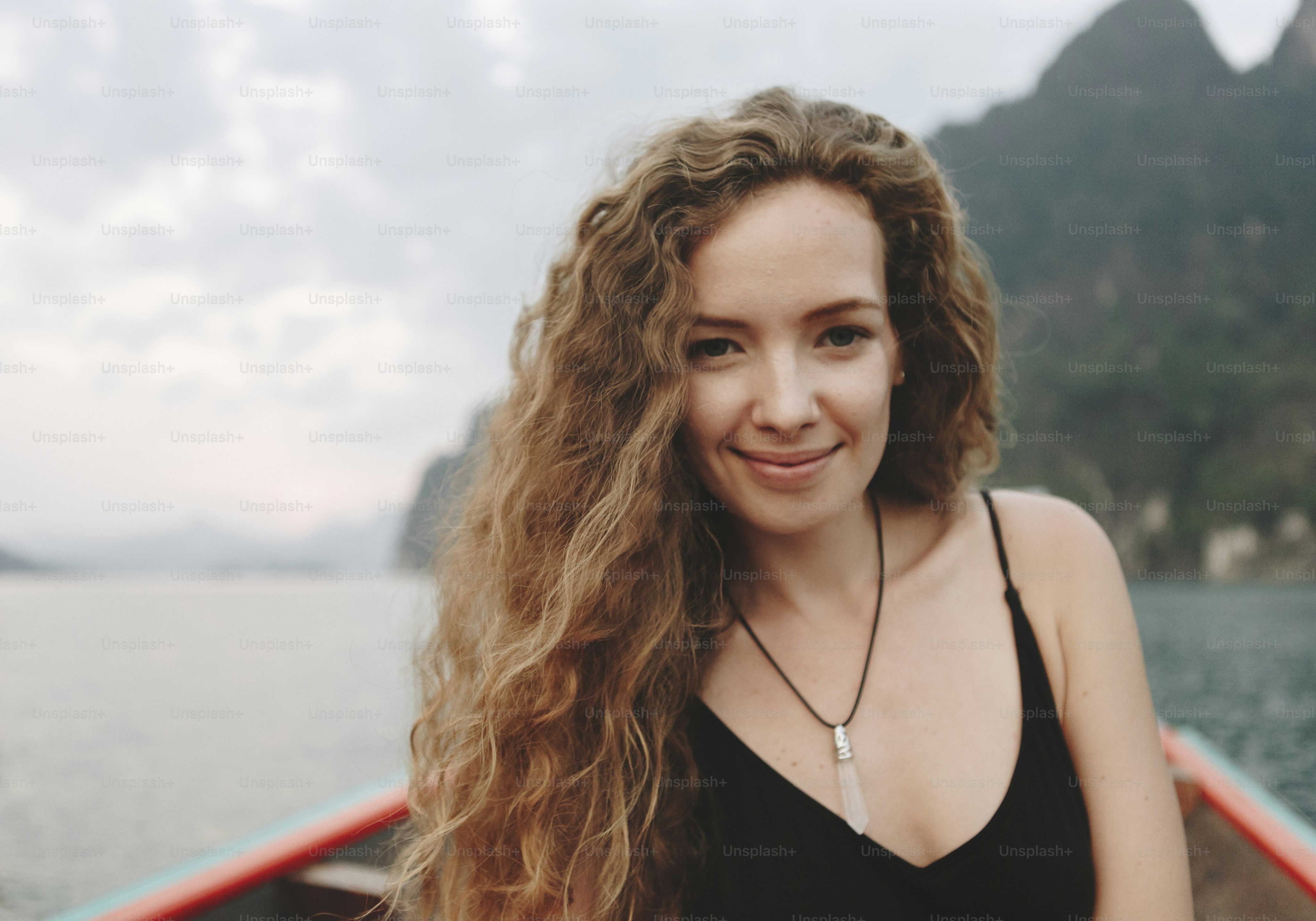 Portrait of a beautiful woman with curly hair photo – Portrait Image on ...