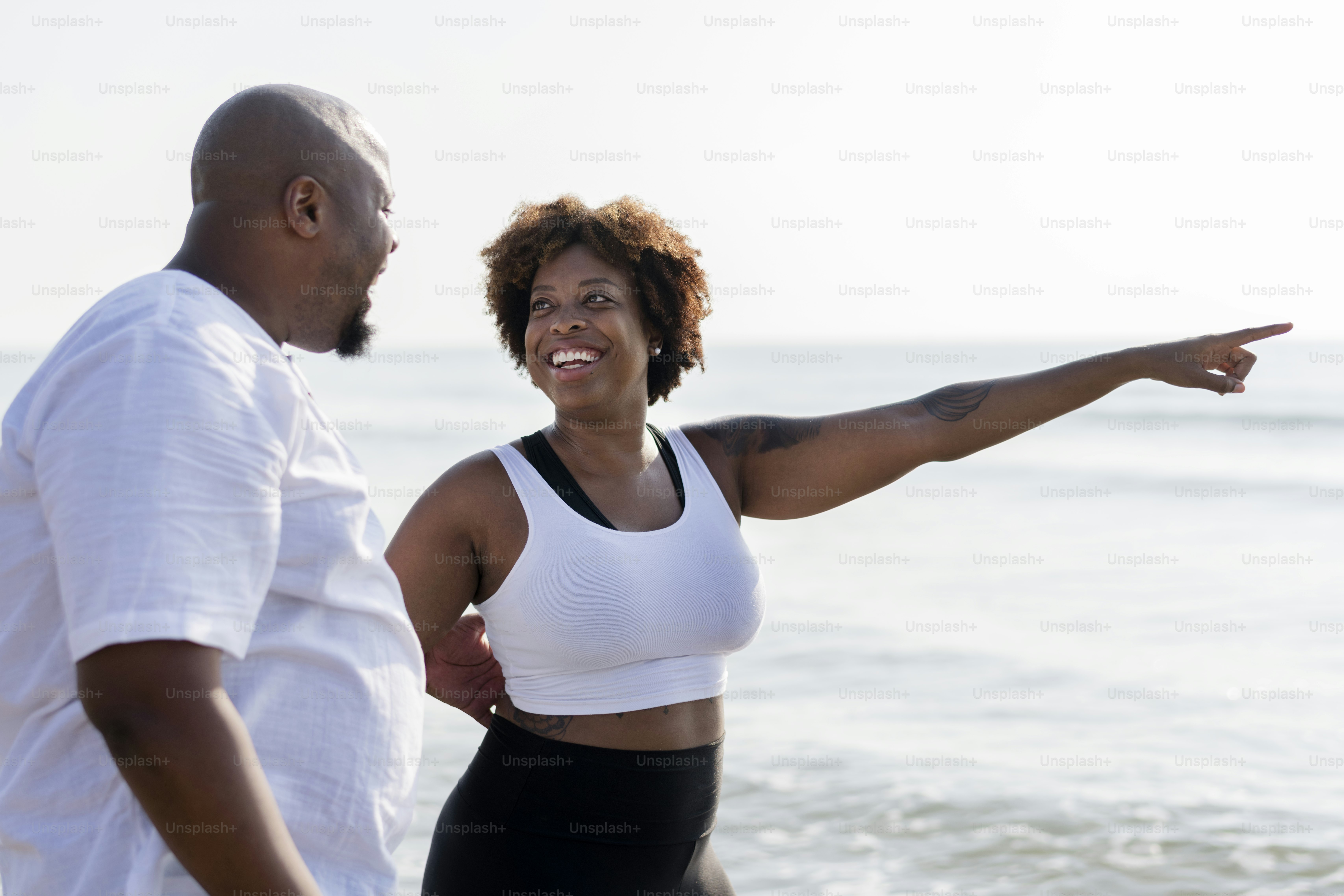 African American couple working out at the beach