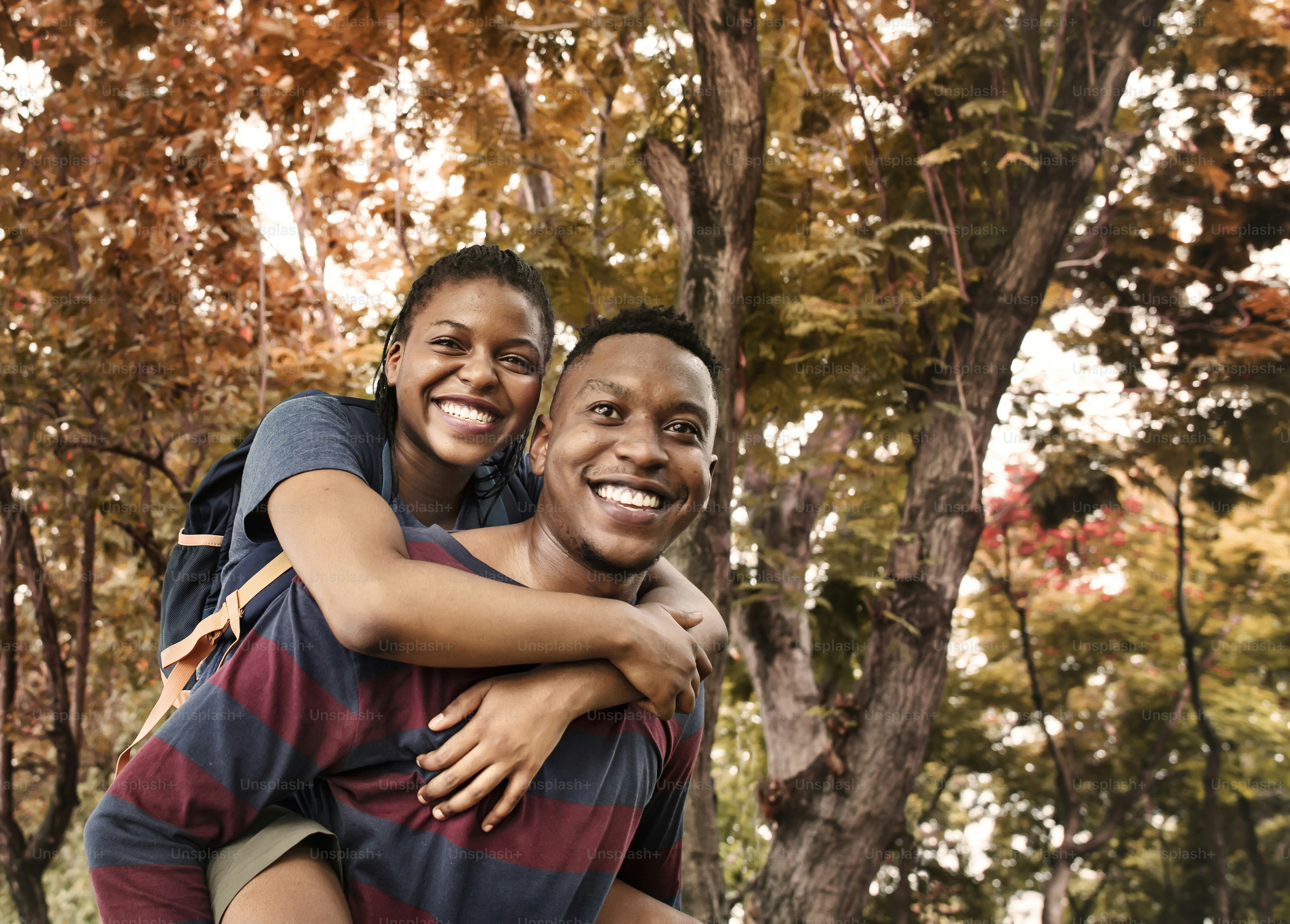 Man giving his girlfriend a piggyback ride