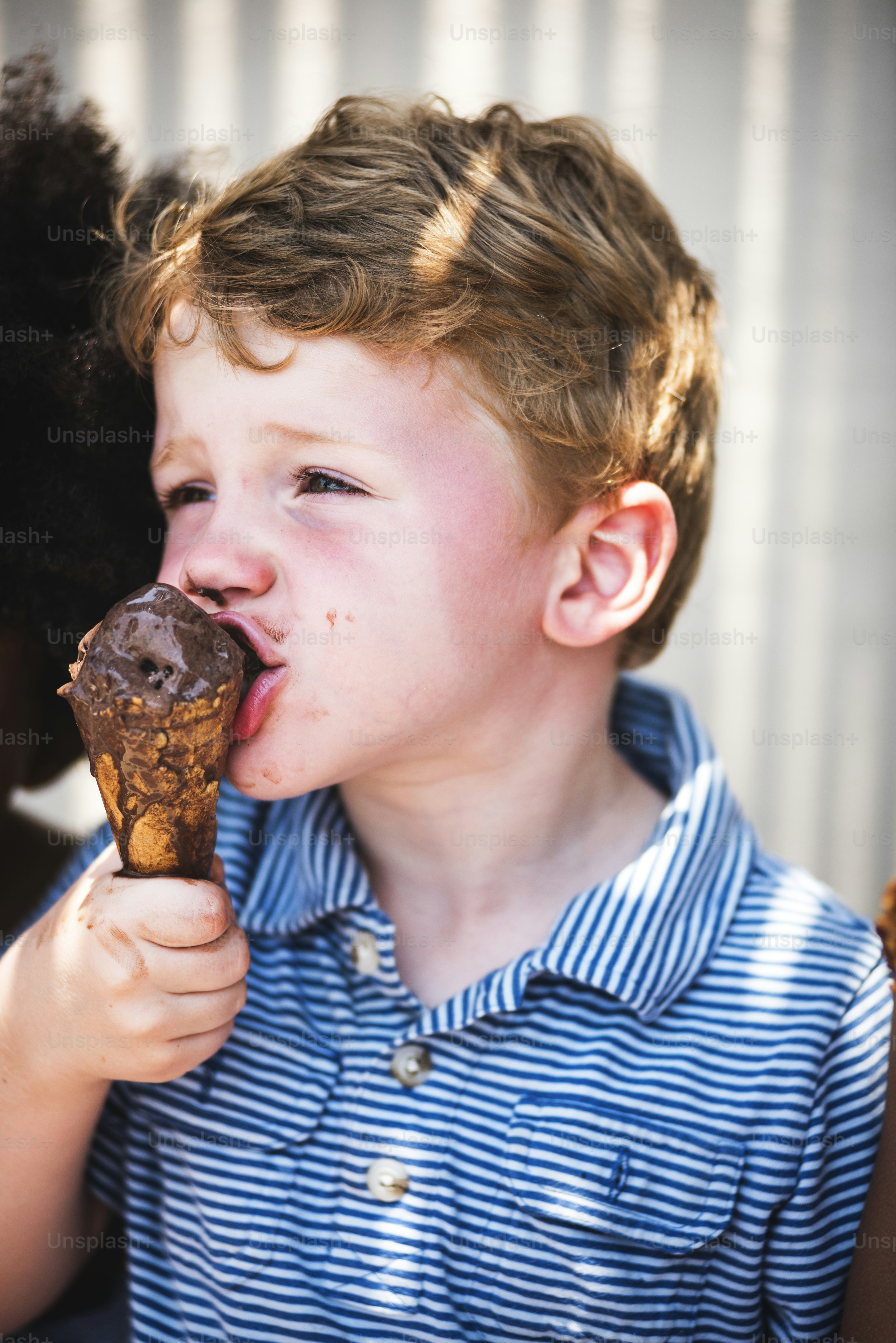 Cute kid having chocolate ice cream