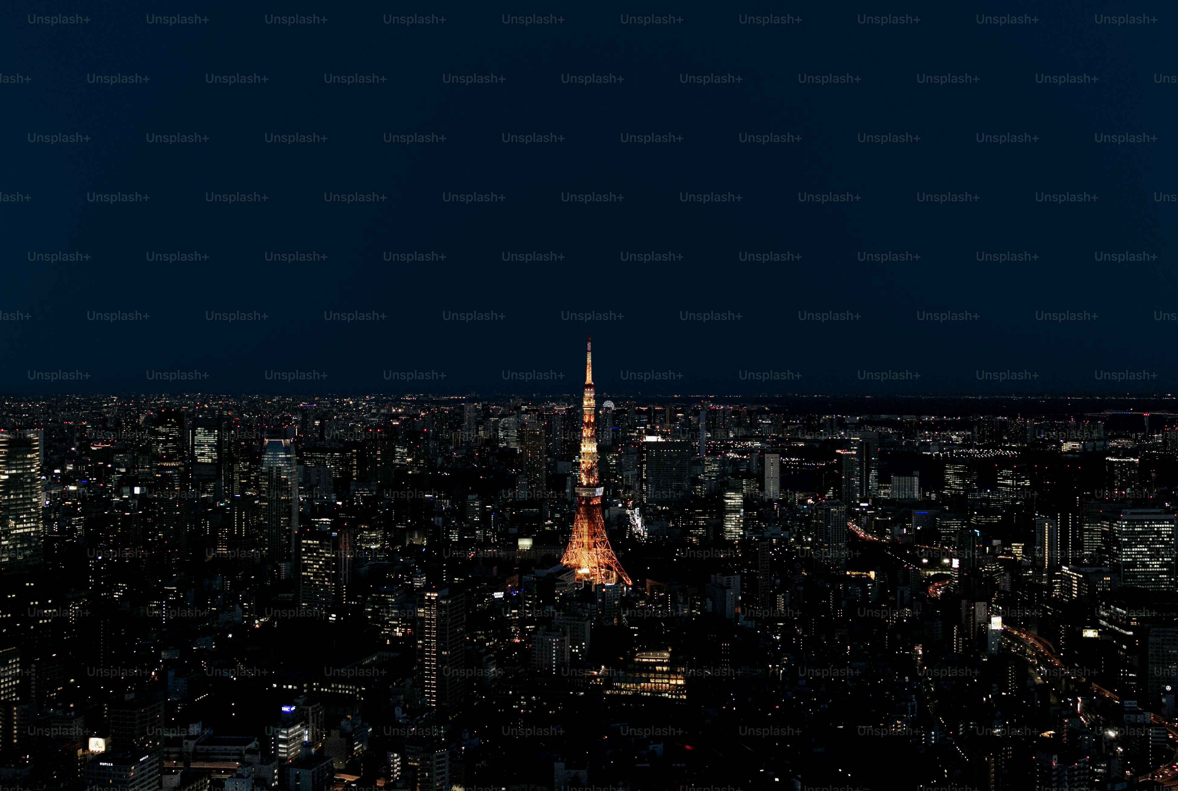A view of a city at night from the top of a building