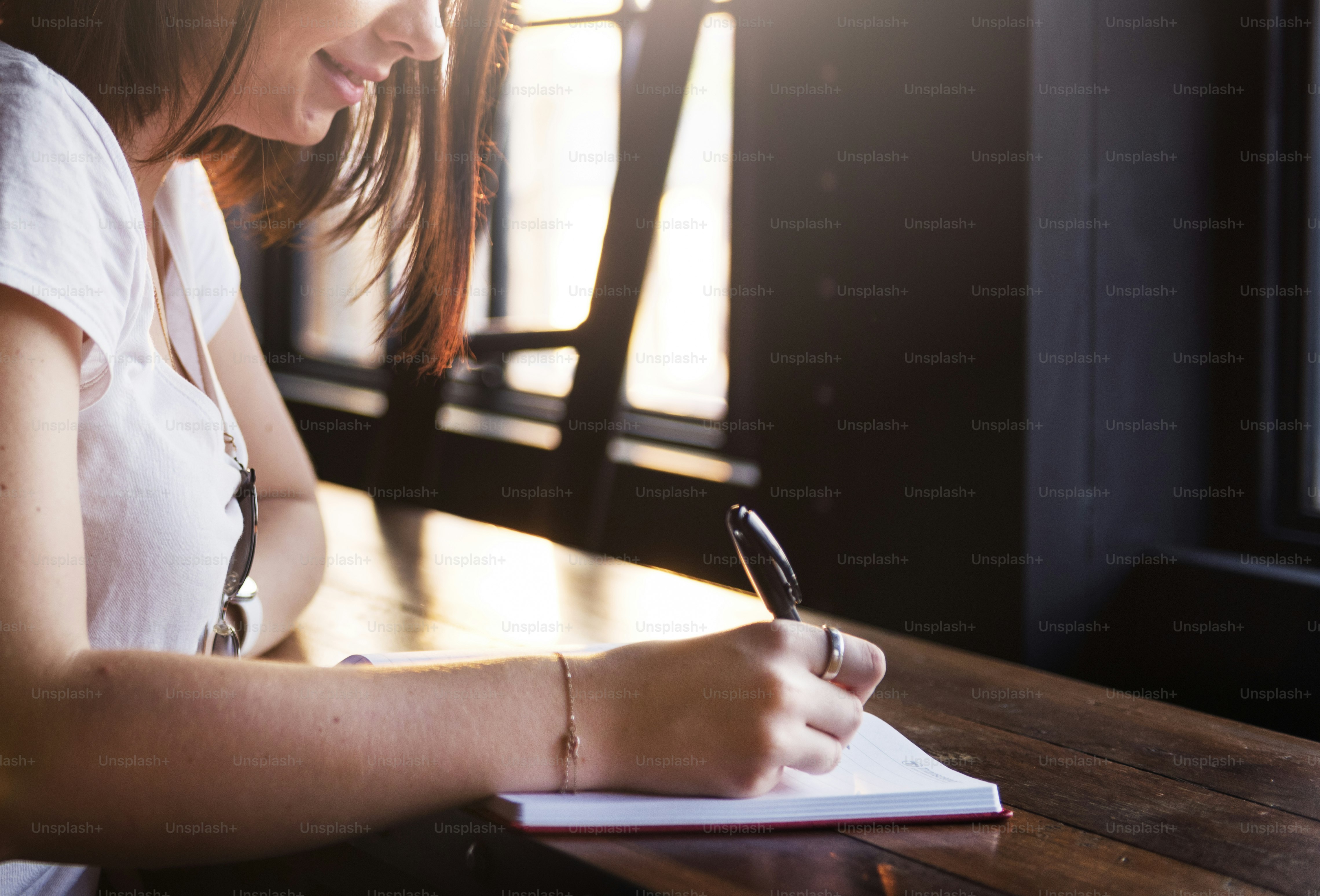 Caucasian girl writing a letter