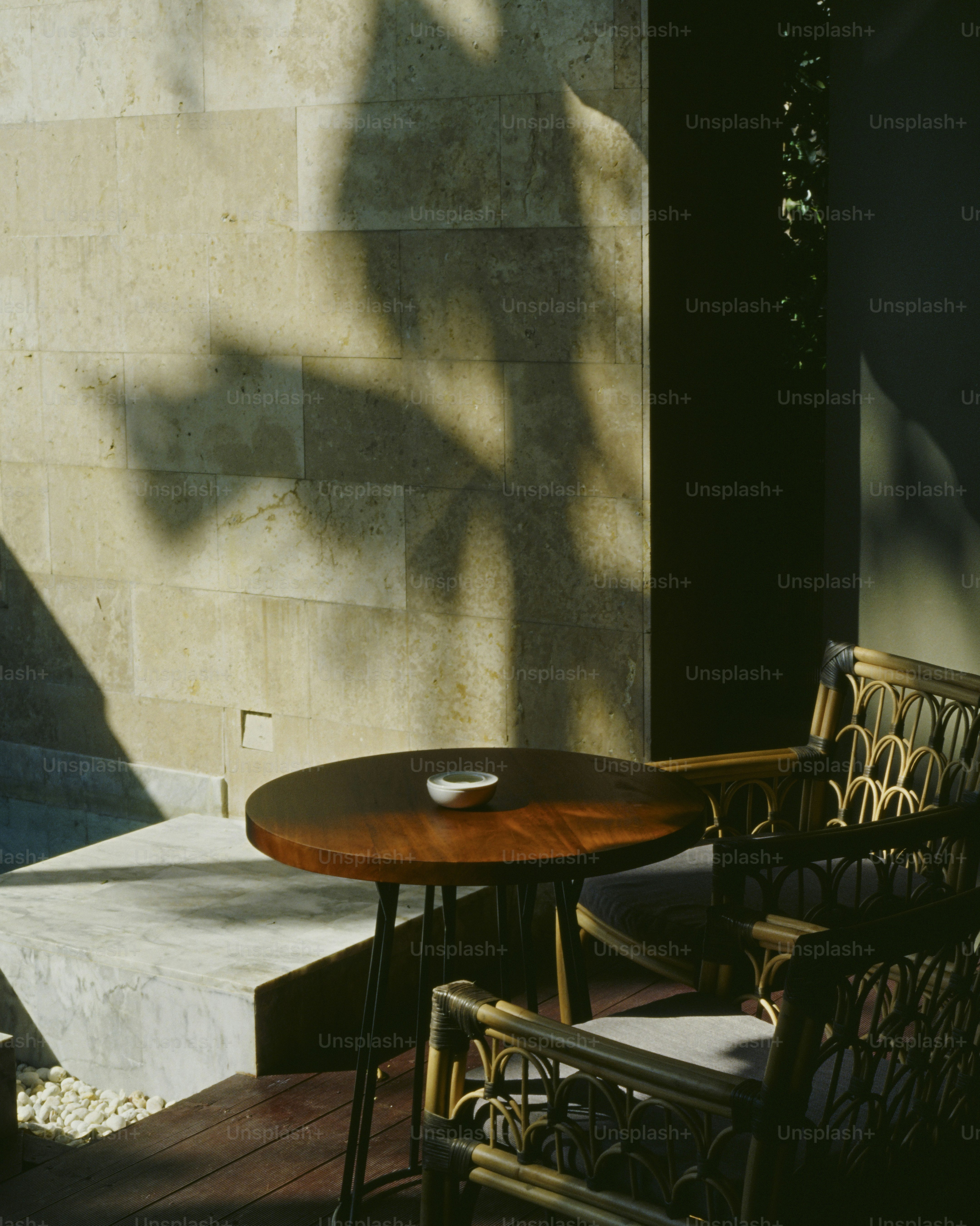 A wooden table sitting next to a wooden chair