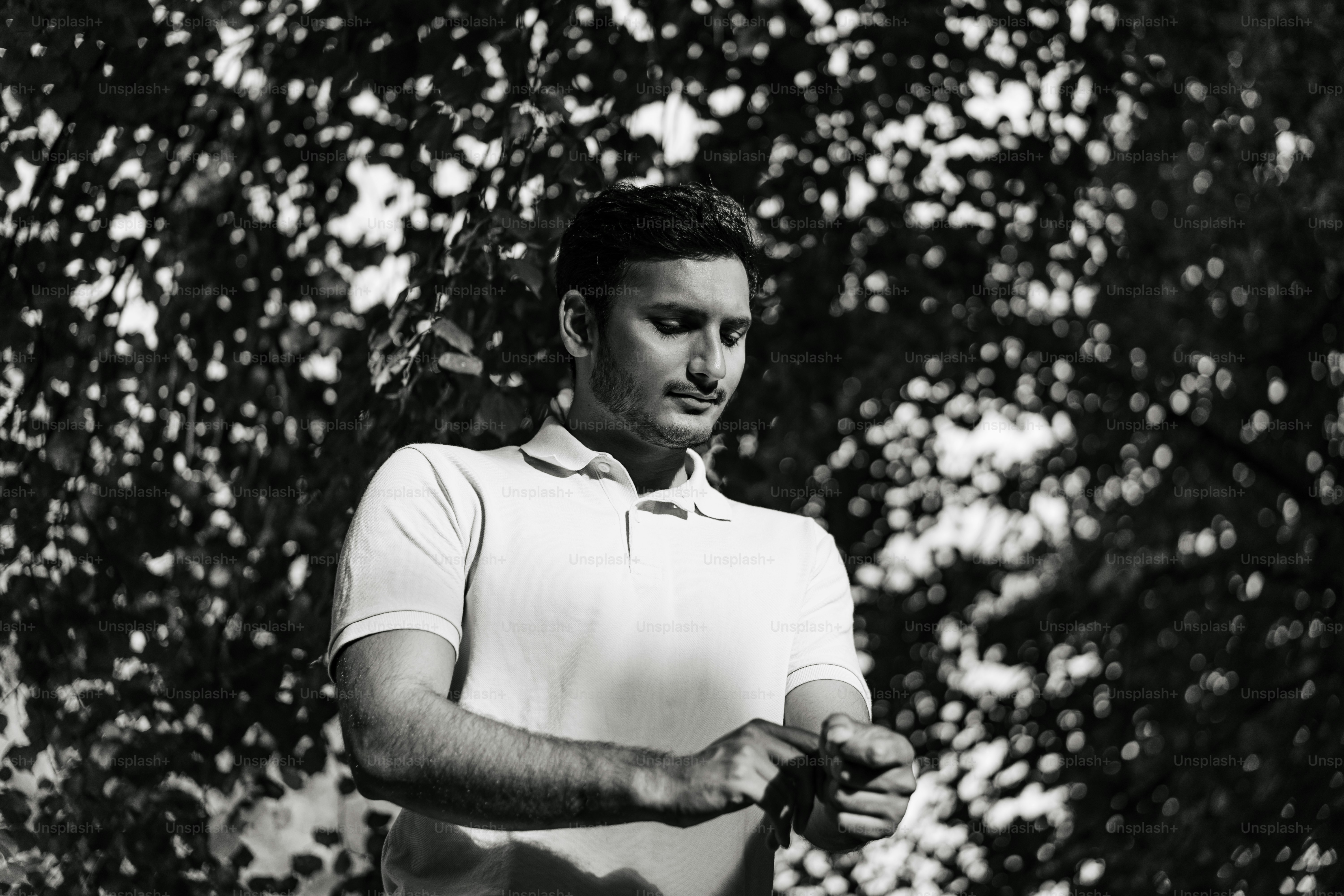 A black and white photo of a man holding a frisbee
