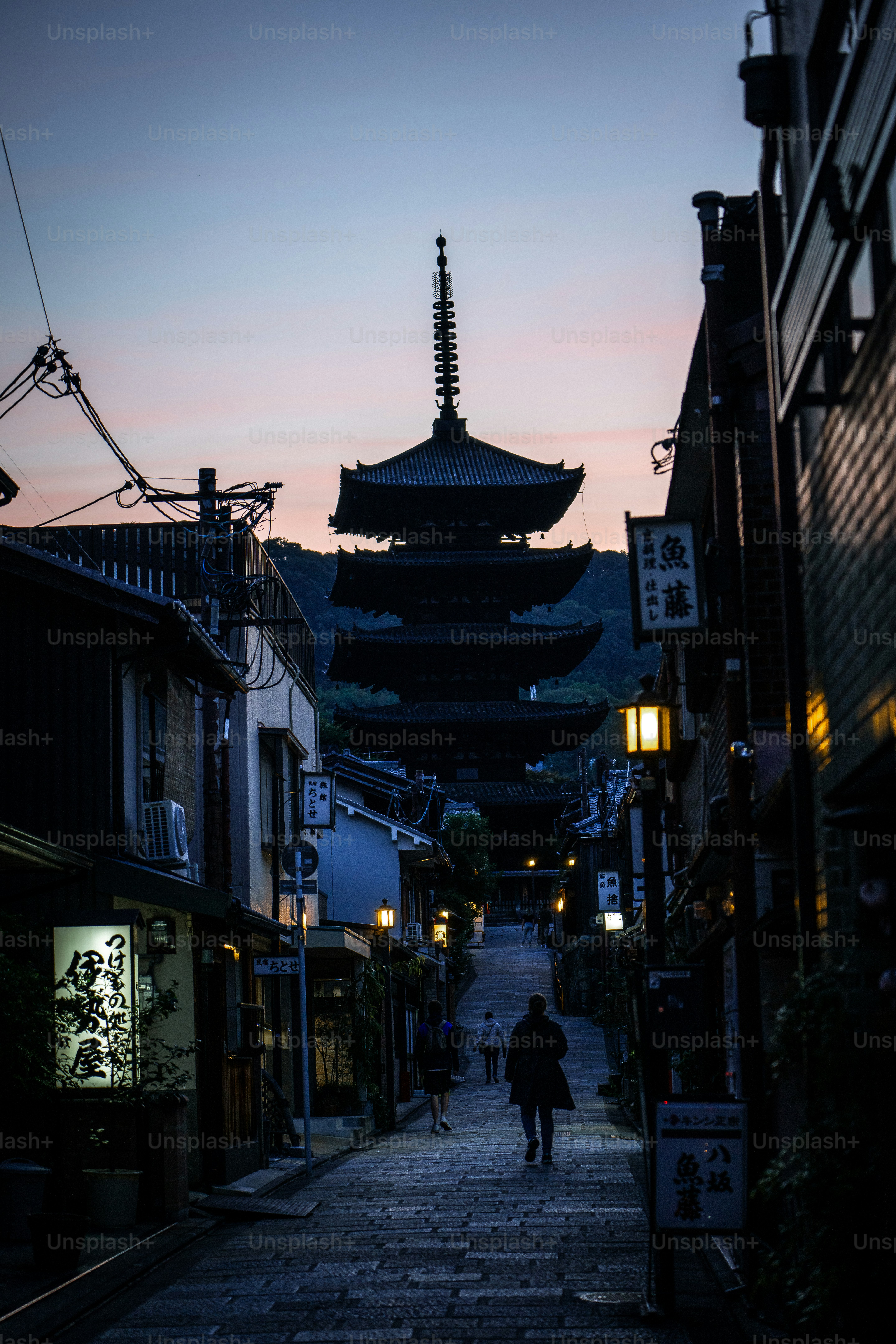 A person walking down a narrow alley way