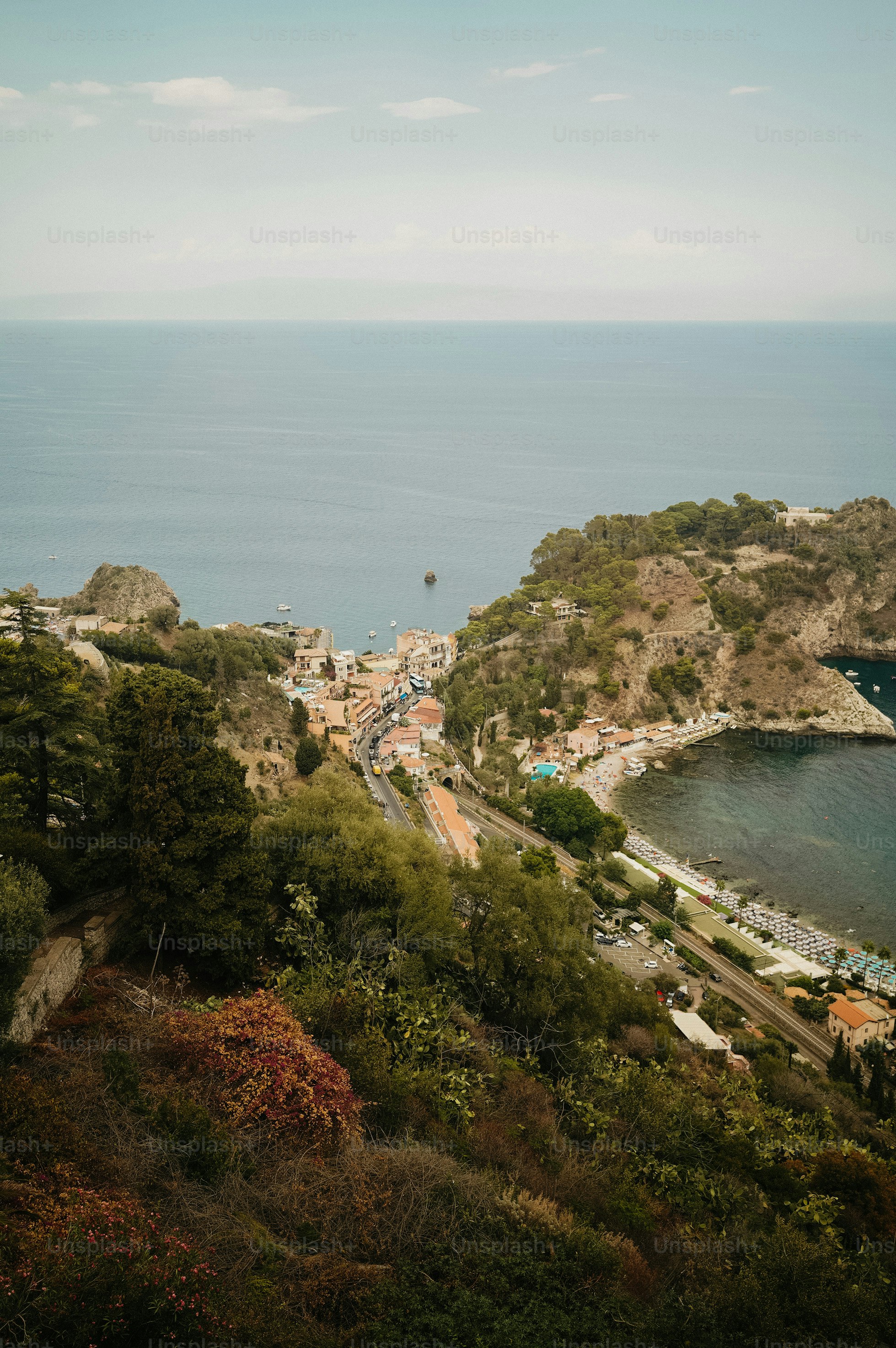 A scenic view of the ocean from a hill