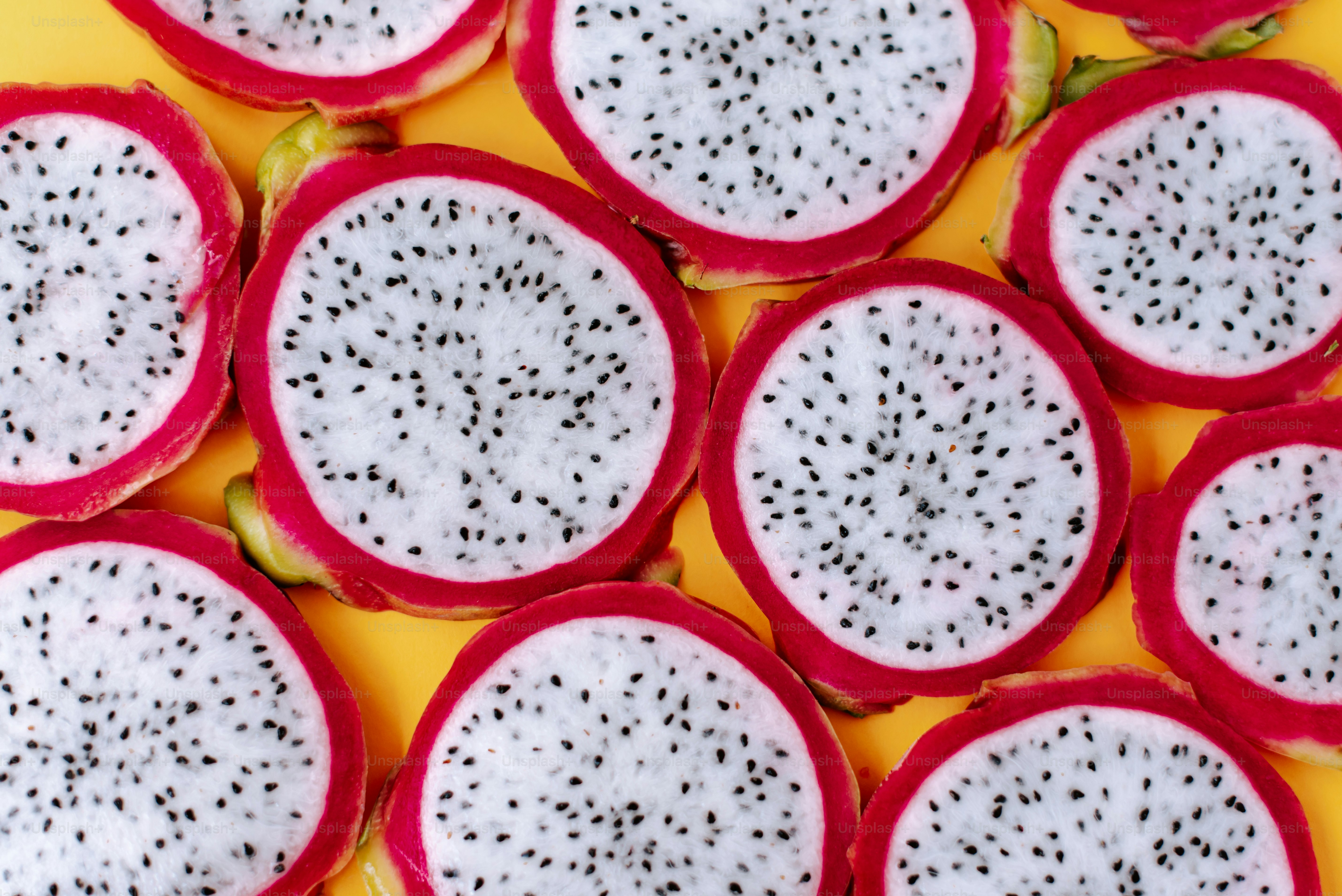 A bunch of cut up fruit sitting on top of a table