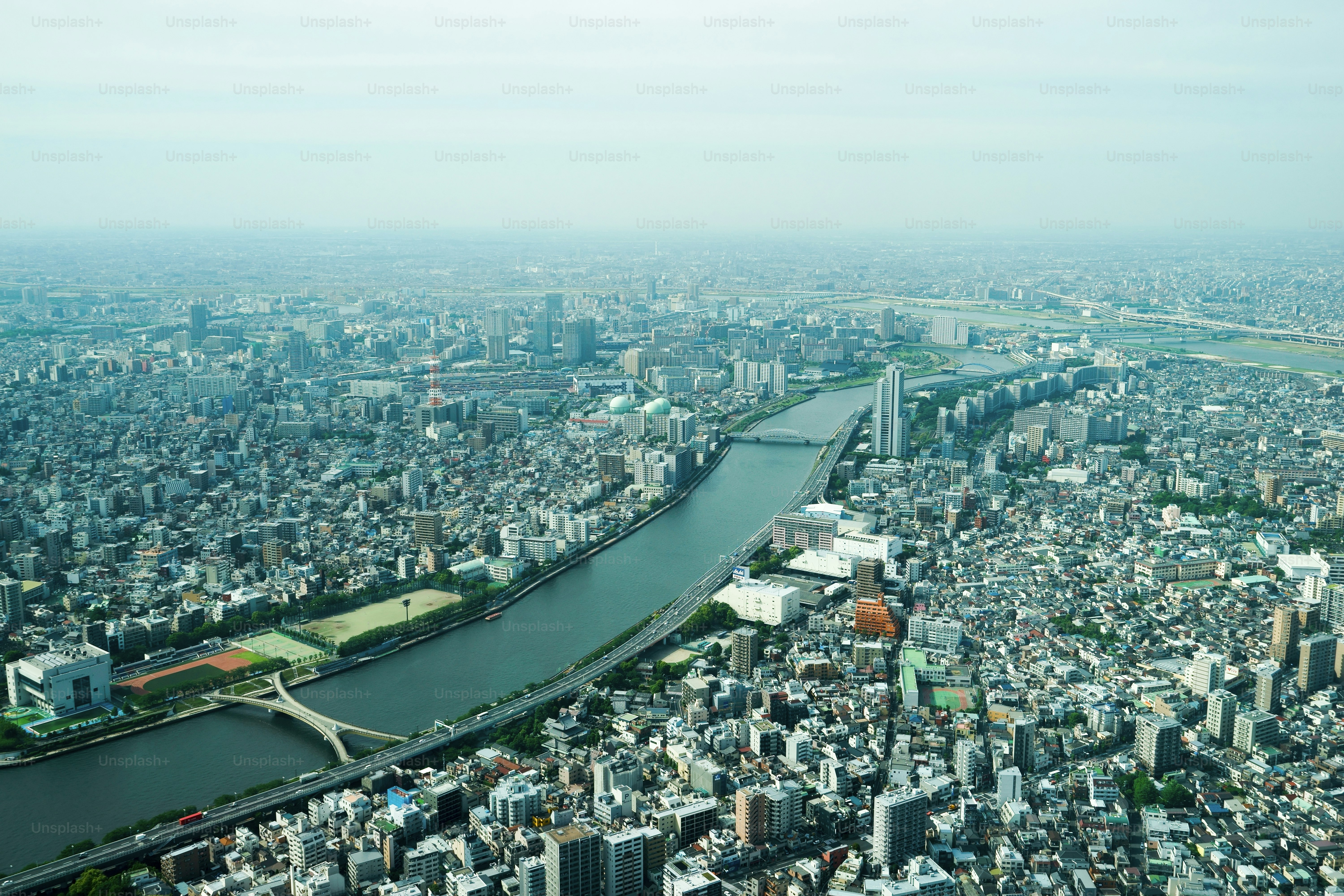 An aerial view of a city with a river running through it