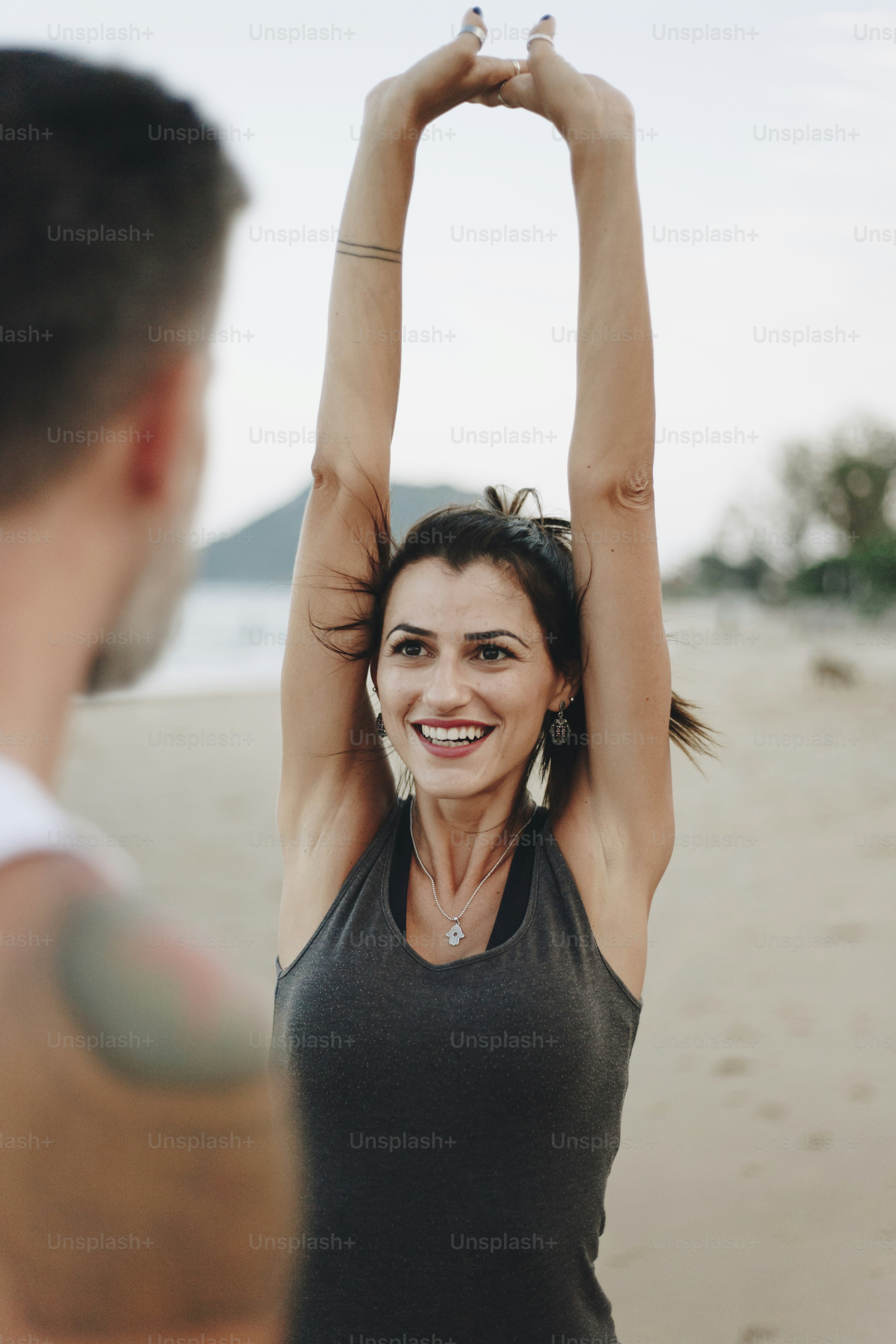 Couple stretching at the beach