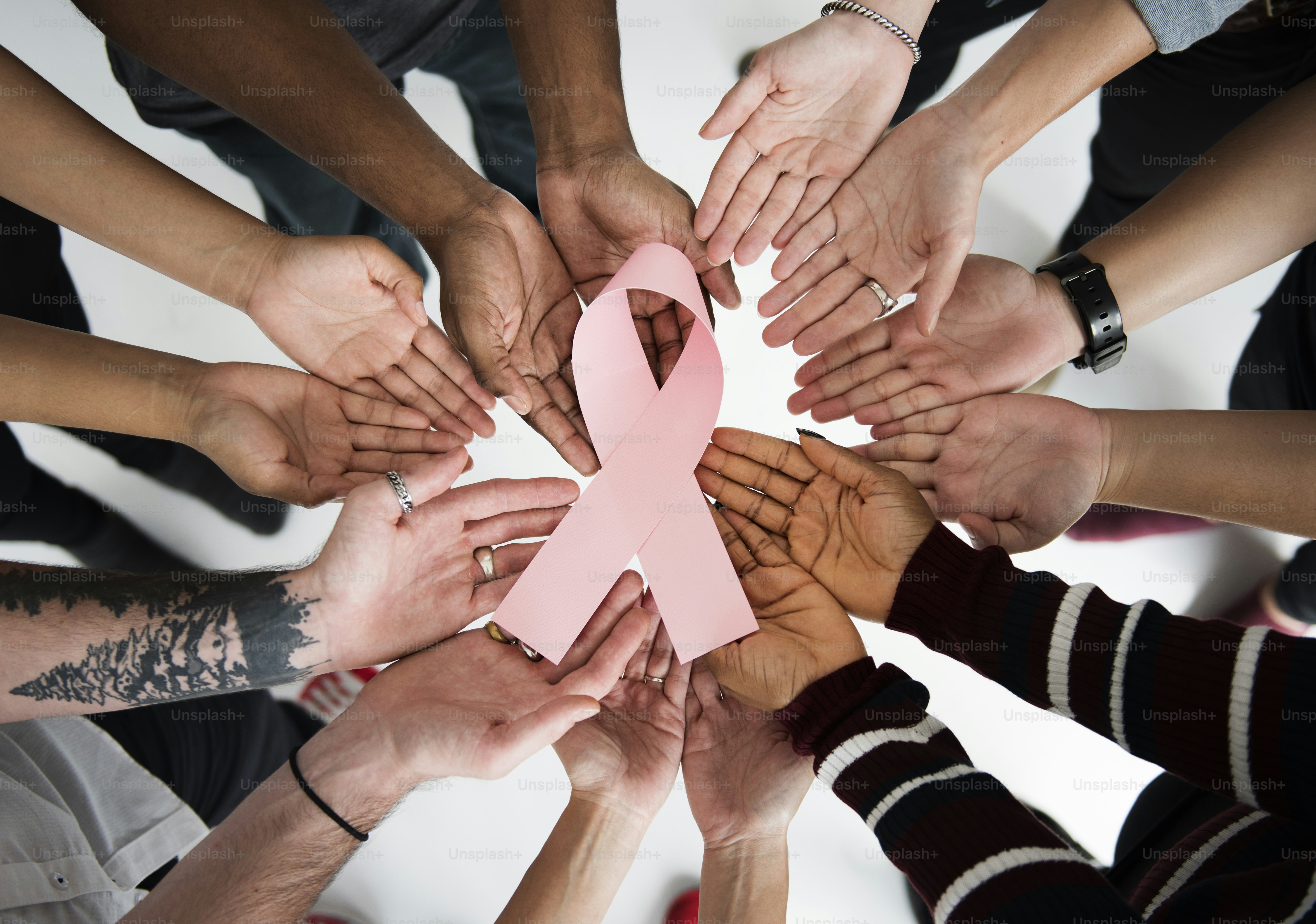 Group of People Holding Ribbon Breast Cancer Concept