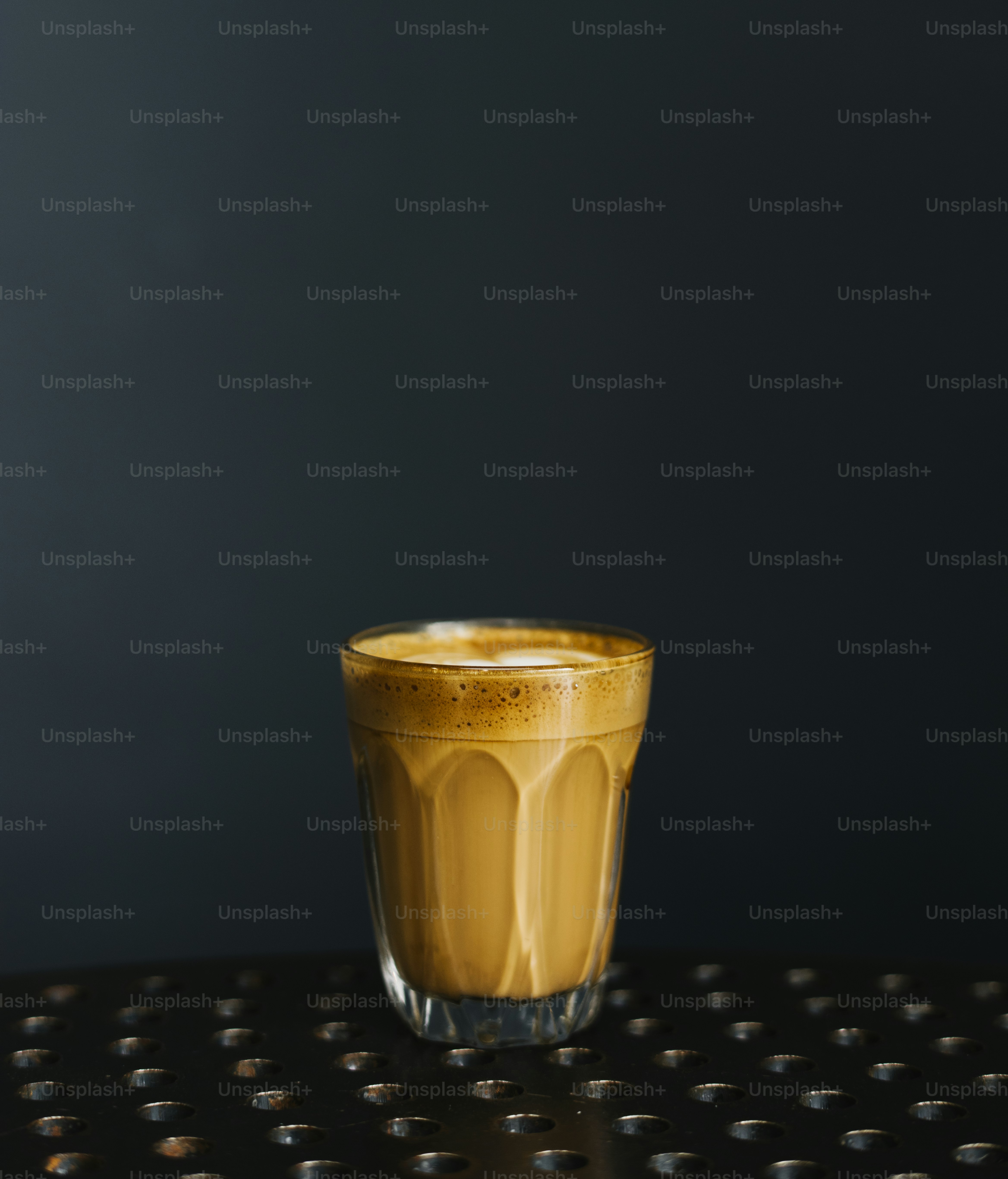A glass of coffee on a table