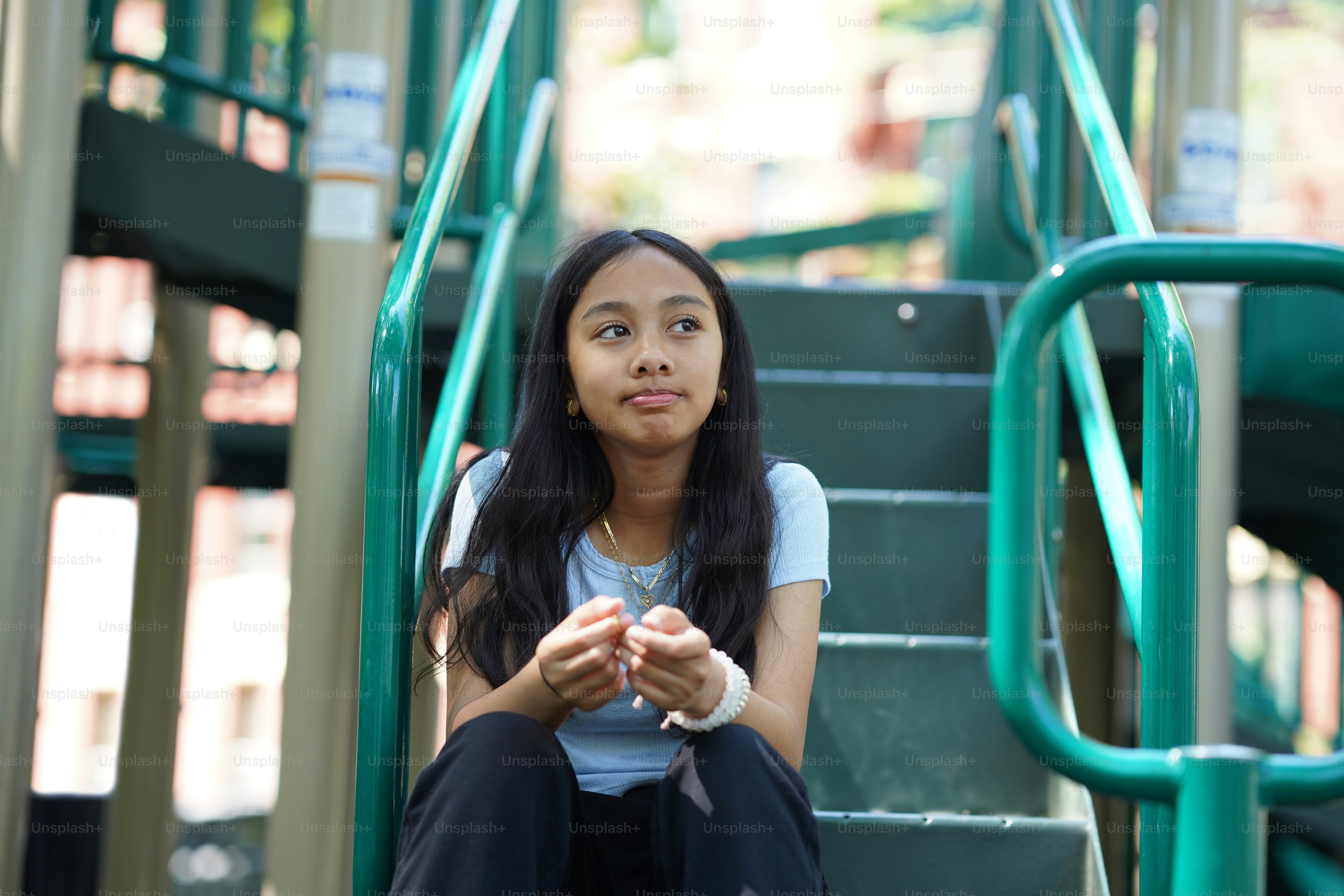 A woman sitting on a set of stairs