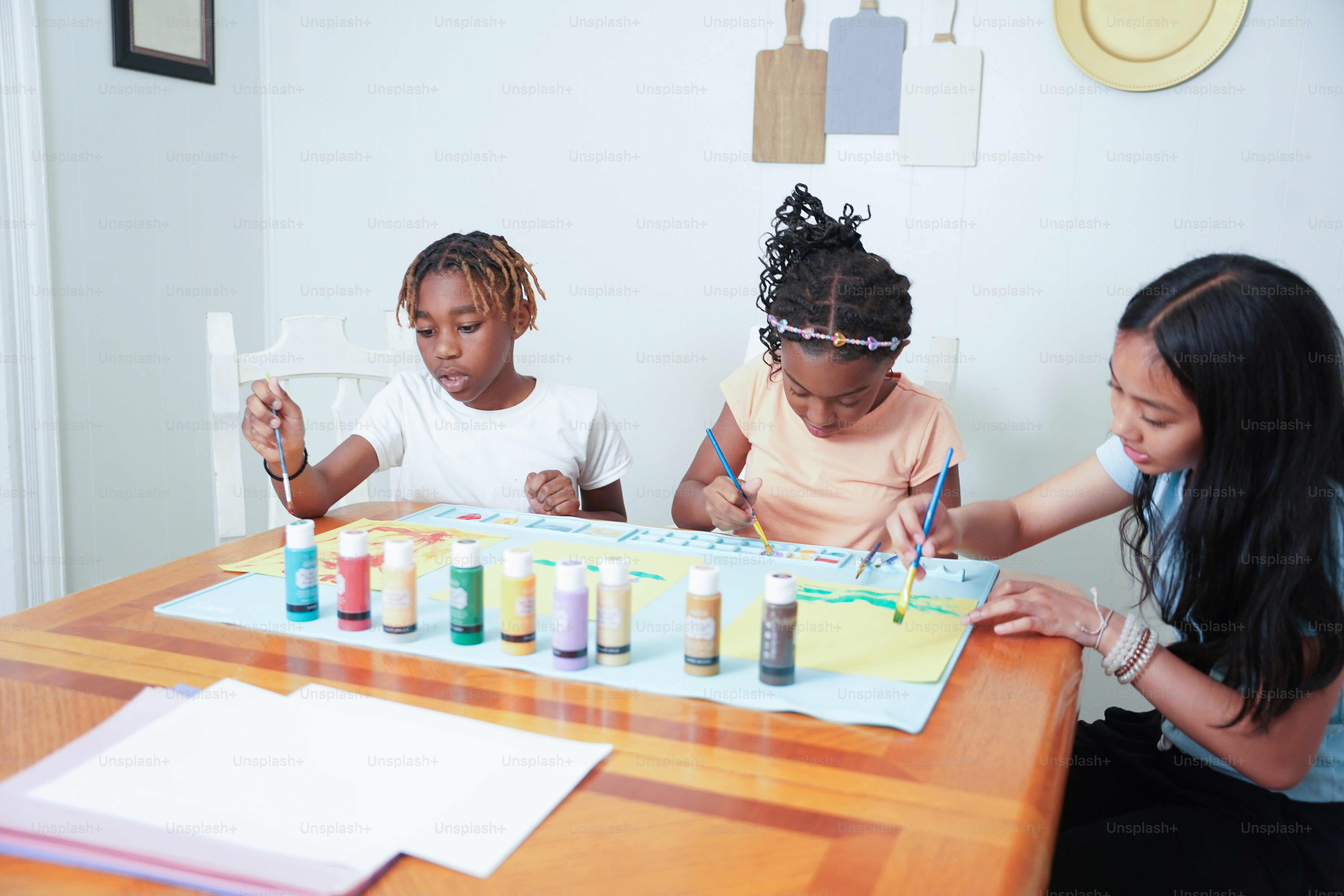 A group of children sitting around a table