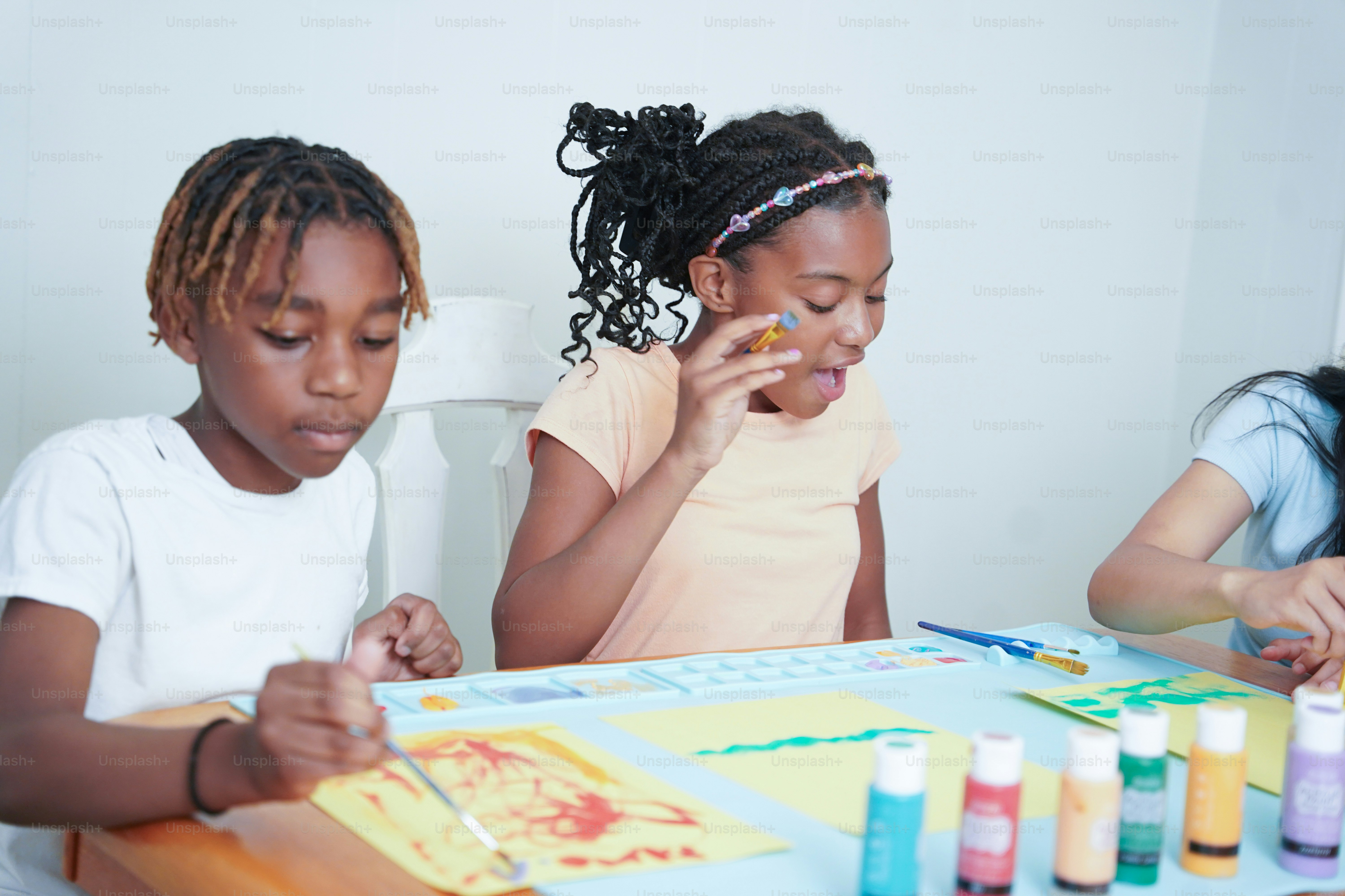 A group of children sitting around a table photo – Painting Image on ...