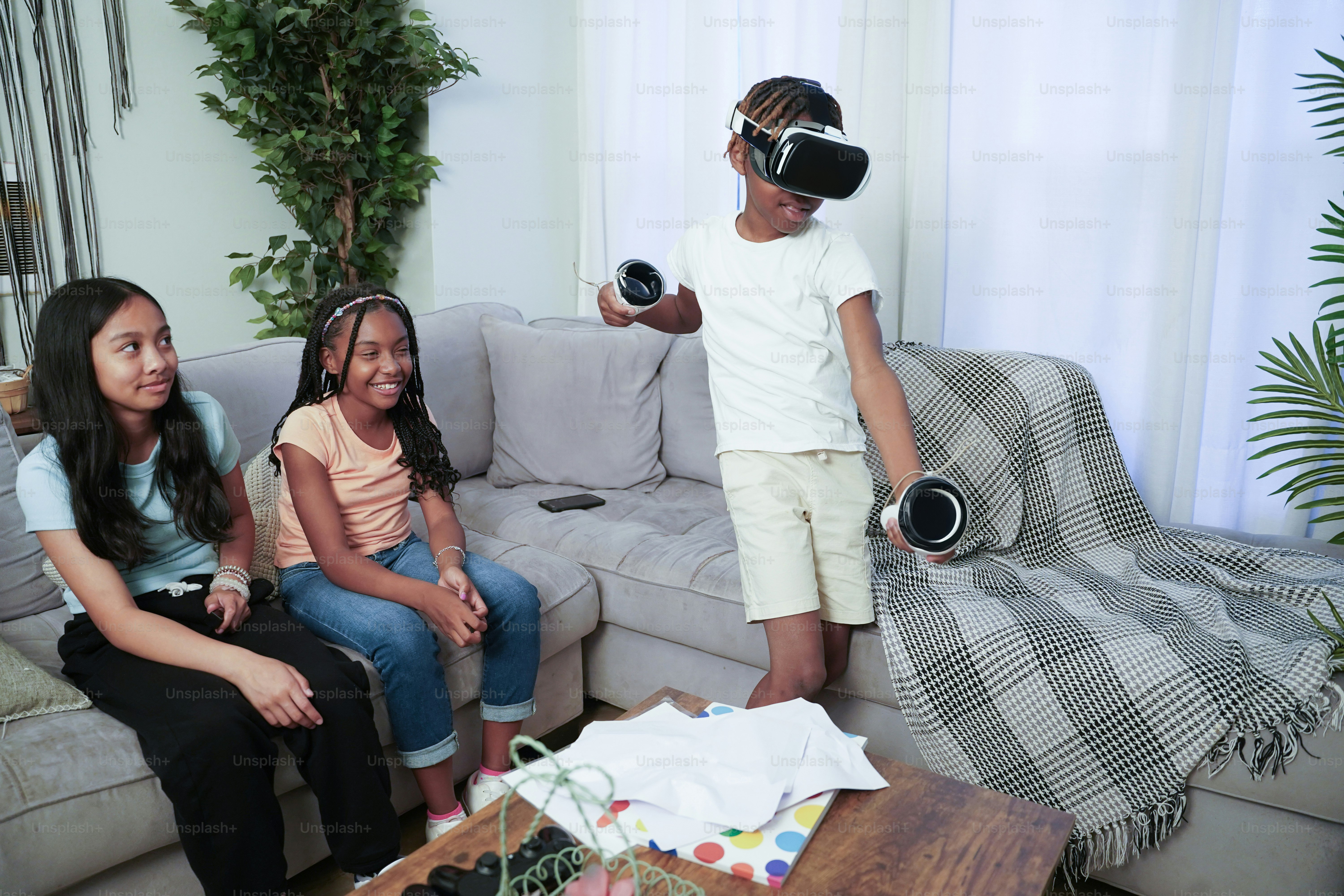 A group of people sitting on a couch in a living room