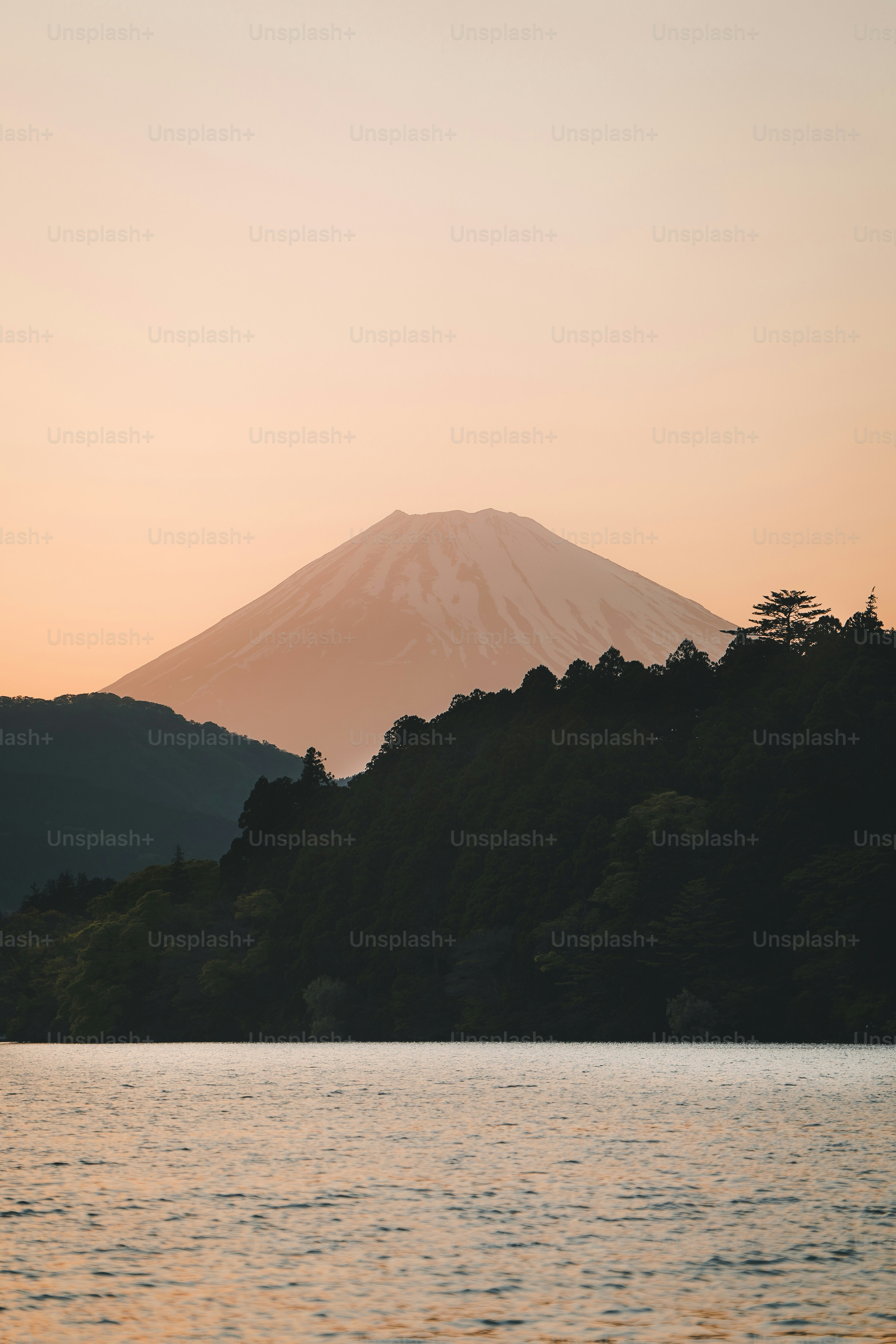 A large body of water with a mountain in the background