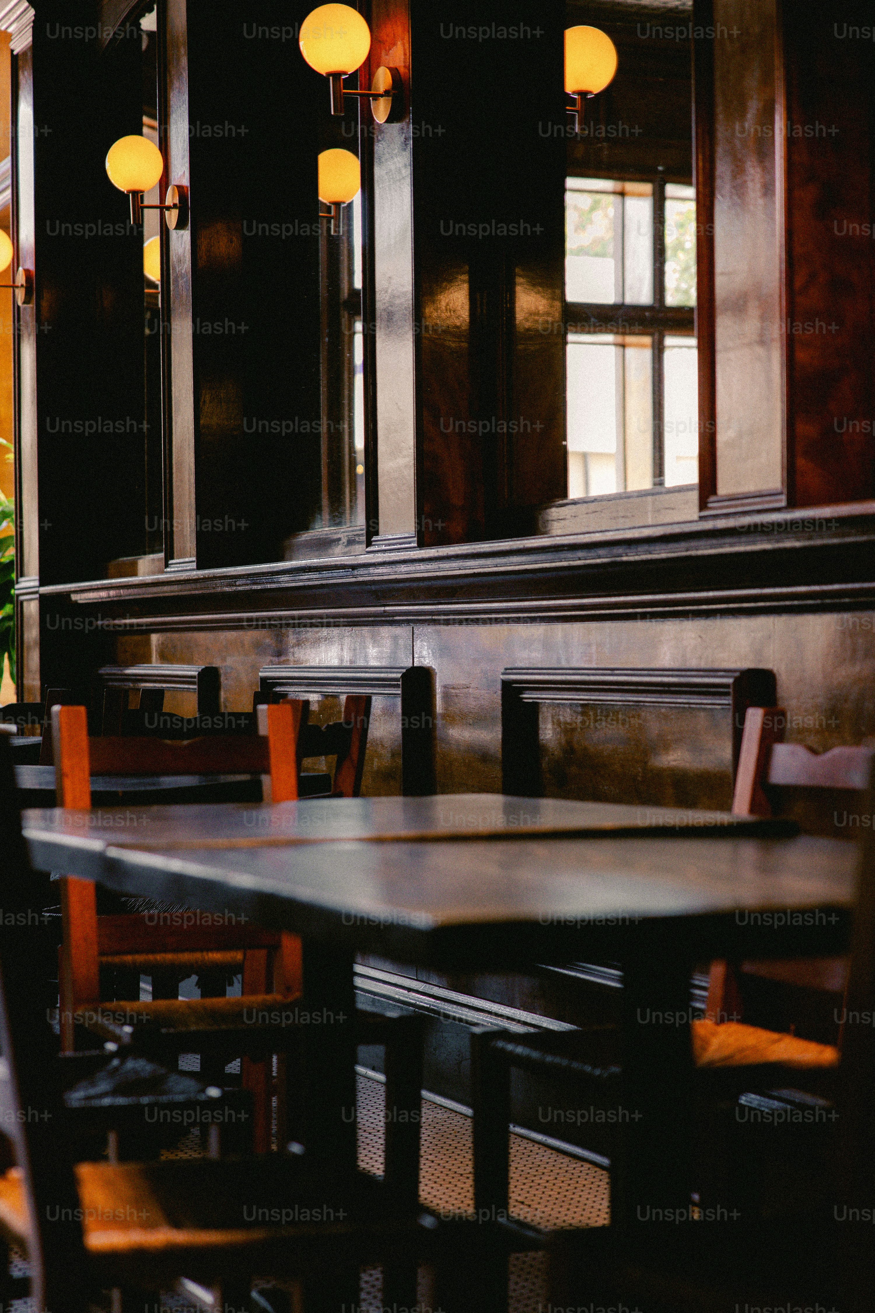 A restaurant with wooden tables and chairs