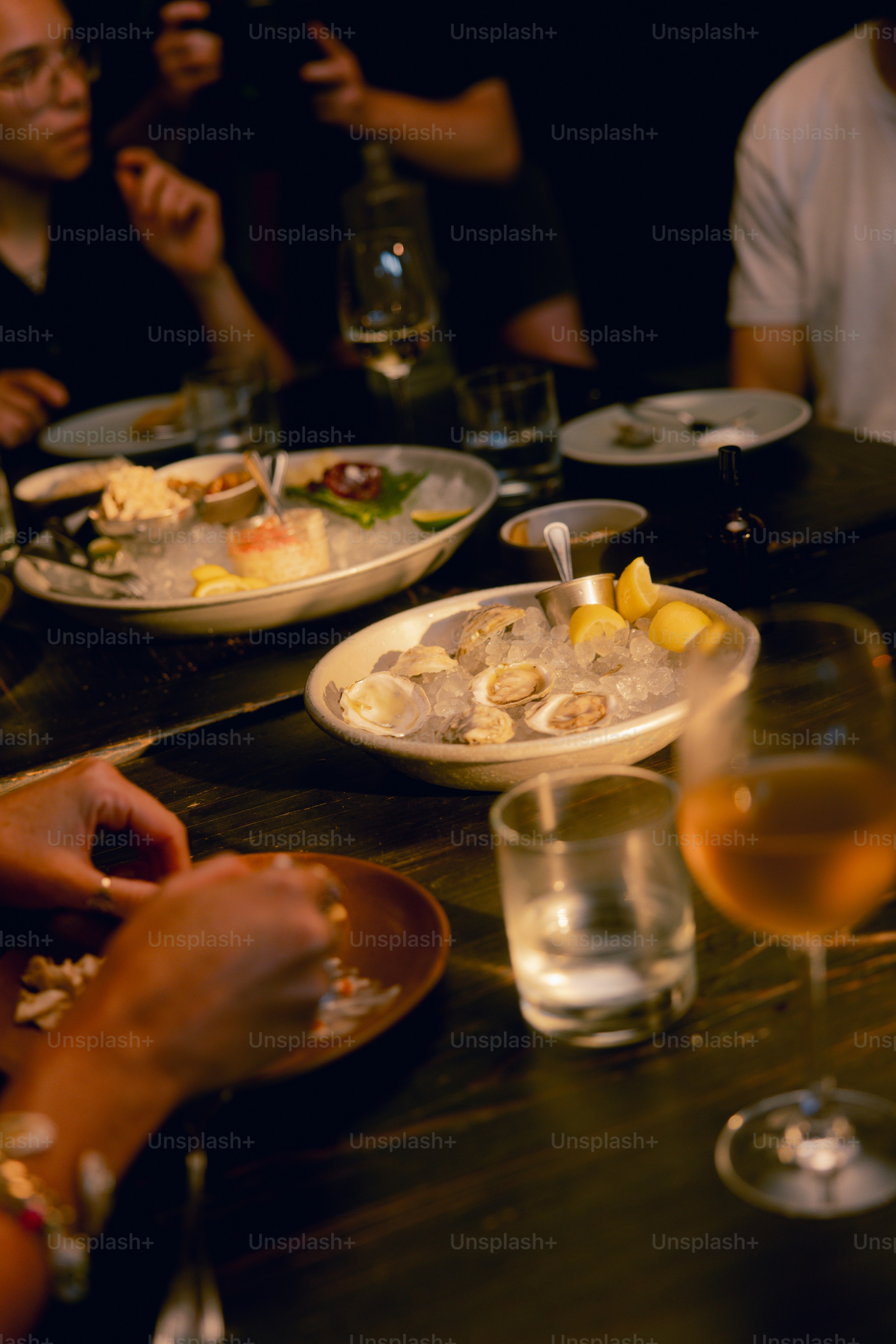 A group of people sitting around a table eating food