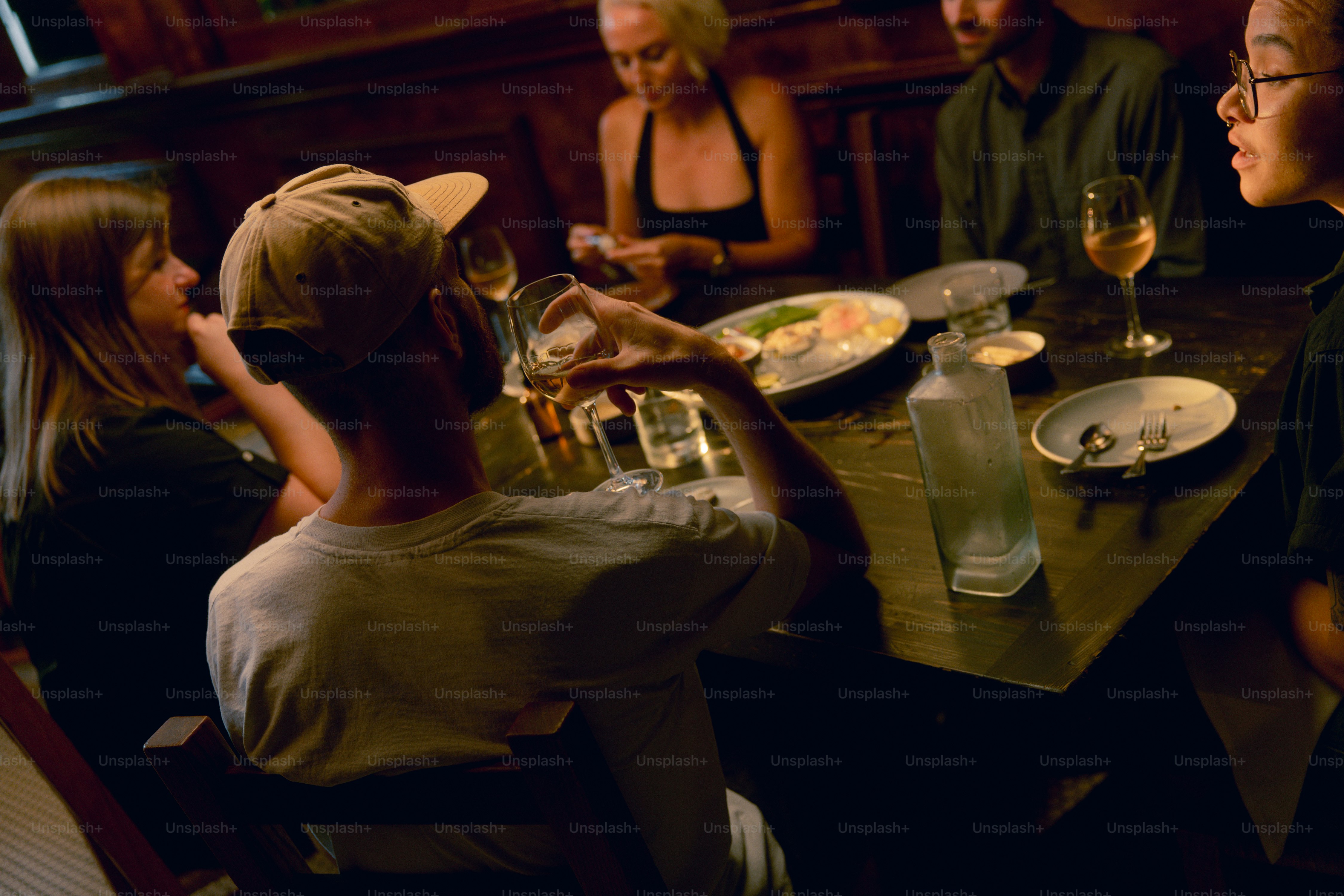 A group of people sitting around a dinner table