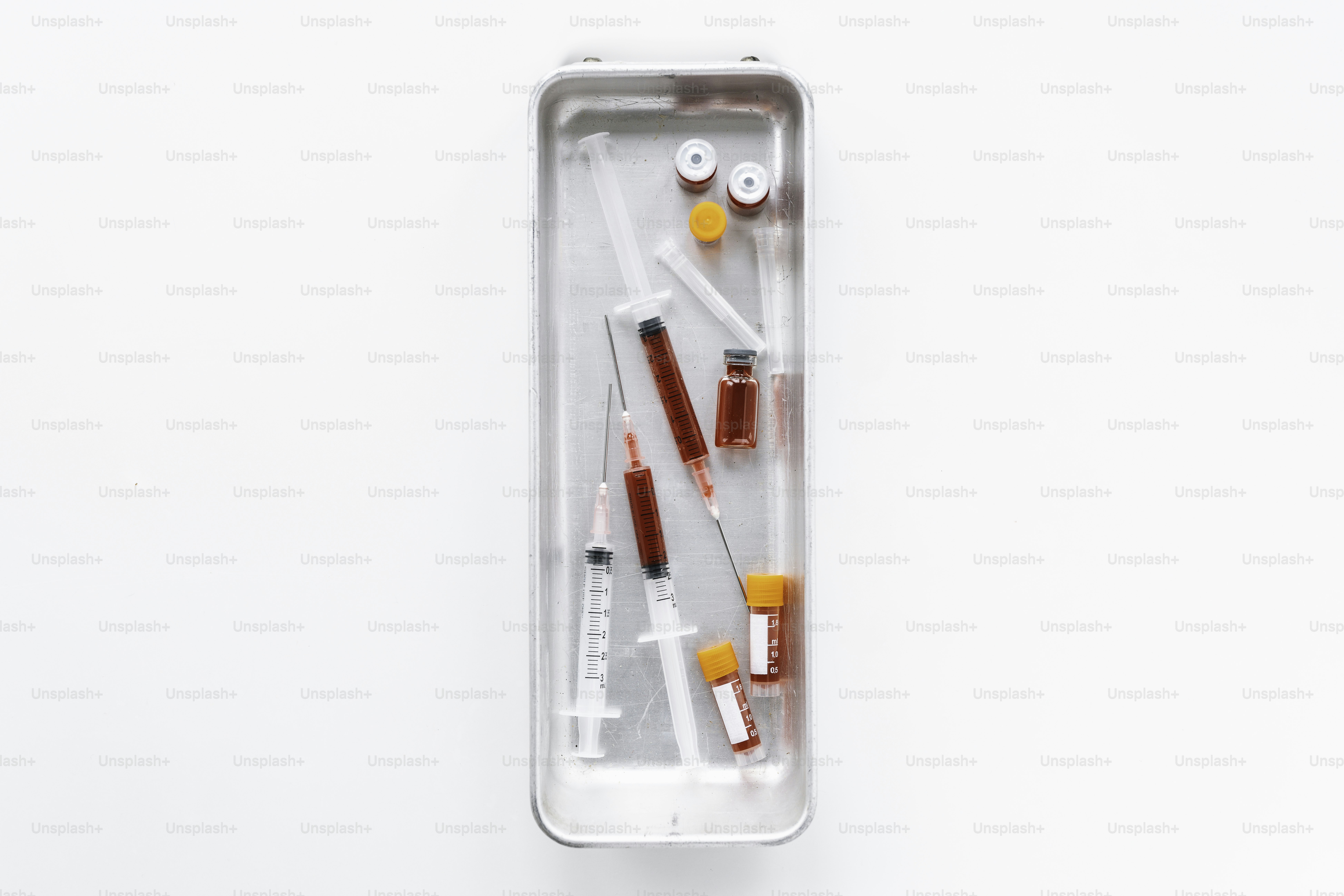 A white box with a red and white toothbrush in it