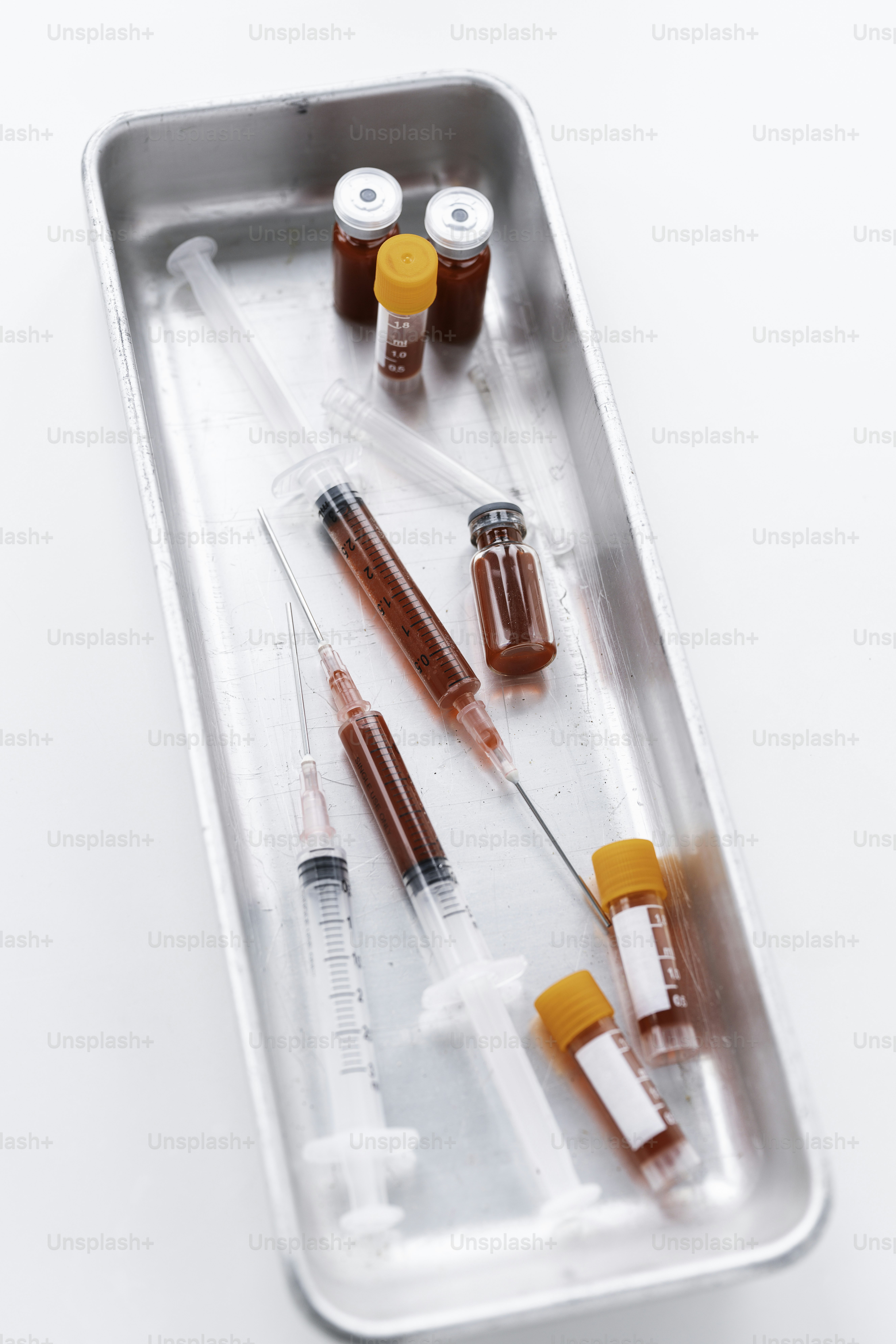 A tray with a bunch of medical supplies in it