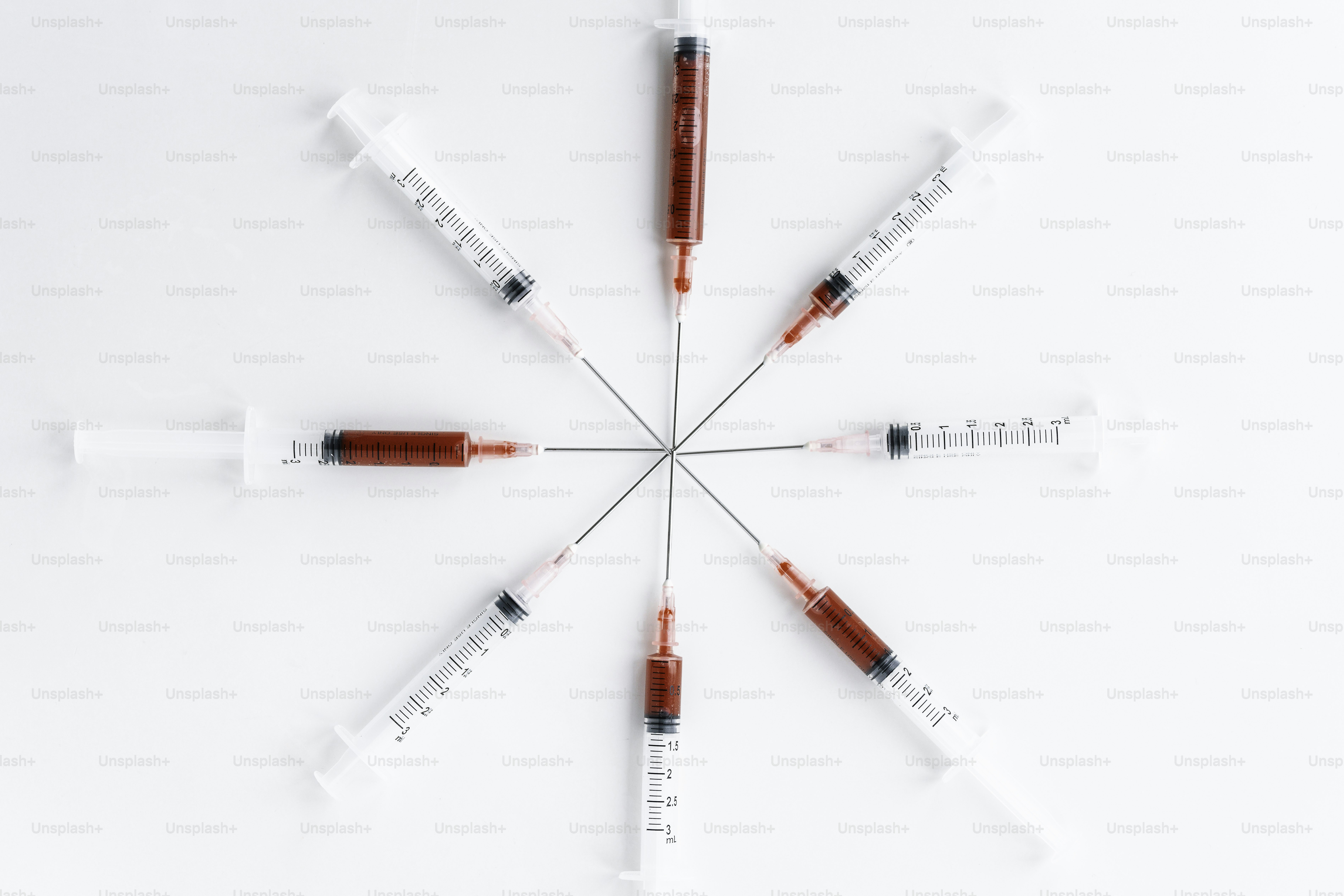 A group of red and white sys sitting on top of a white surface