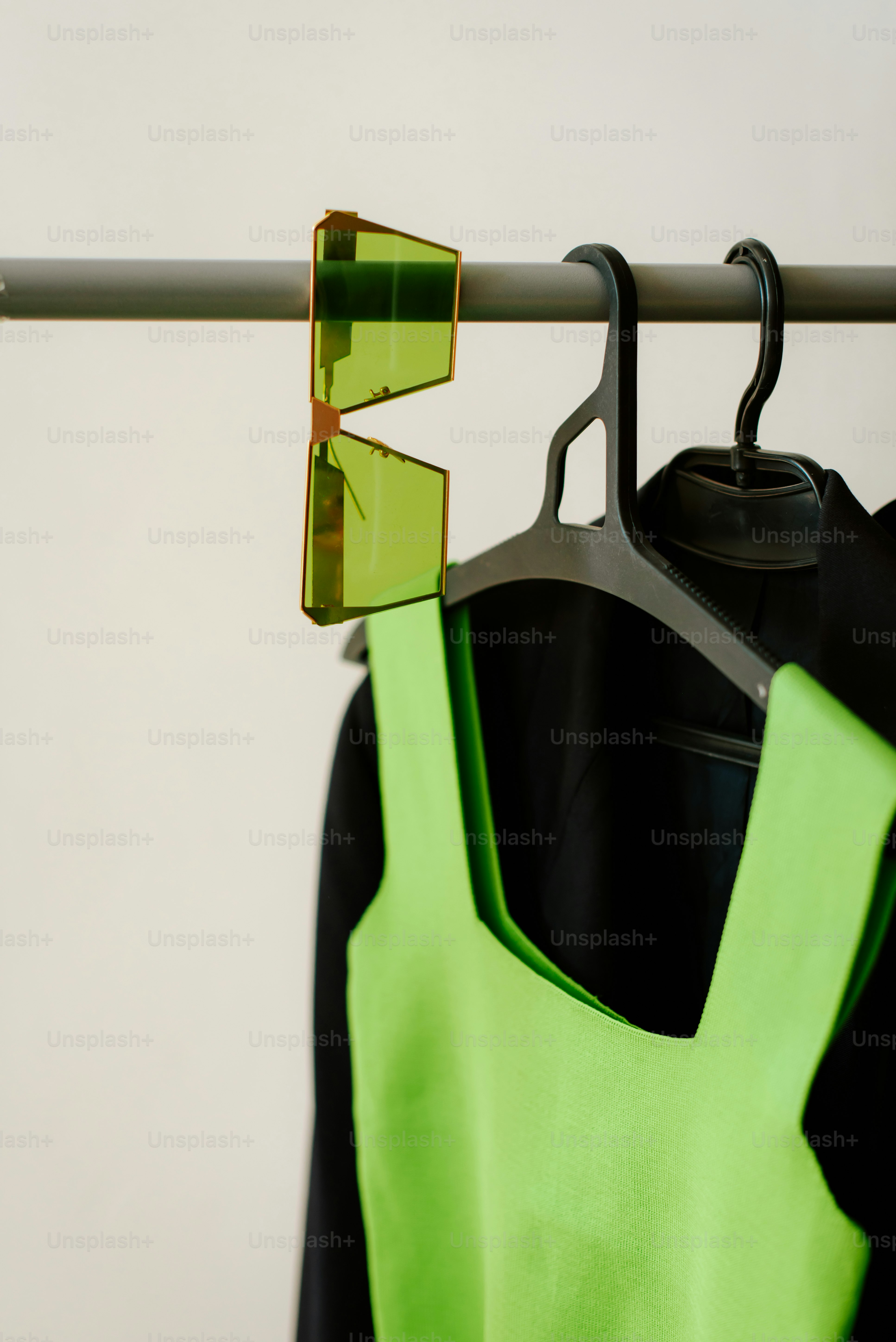 A pair of sunglasses hanging on a clothes rack