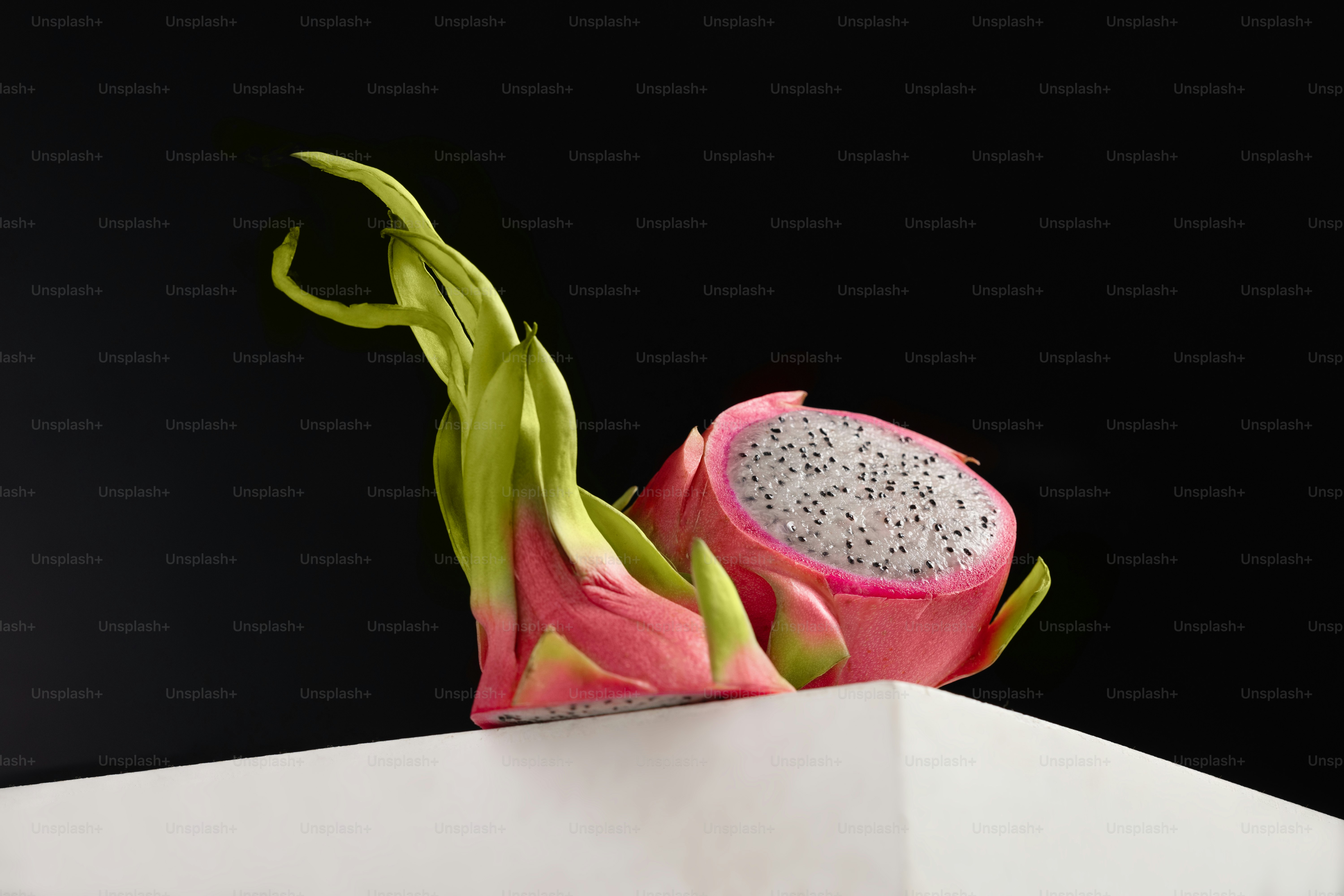 A dragon fruit sitting on top of a white box