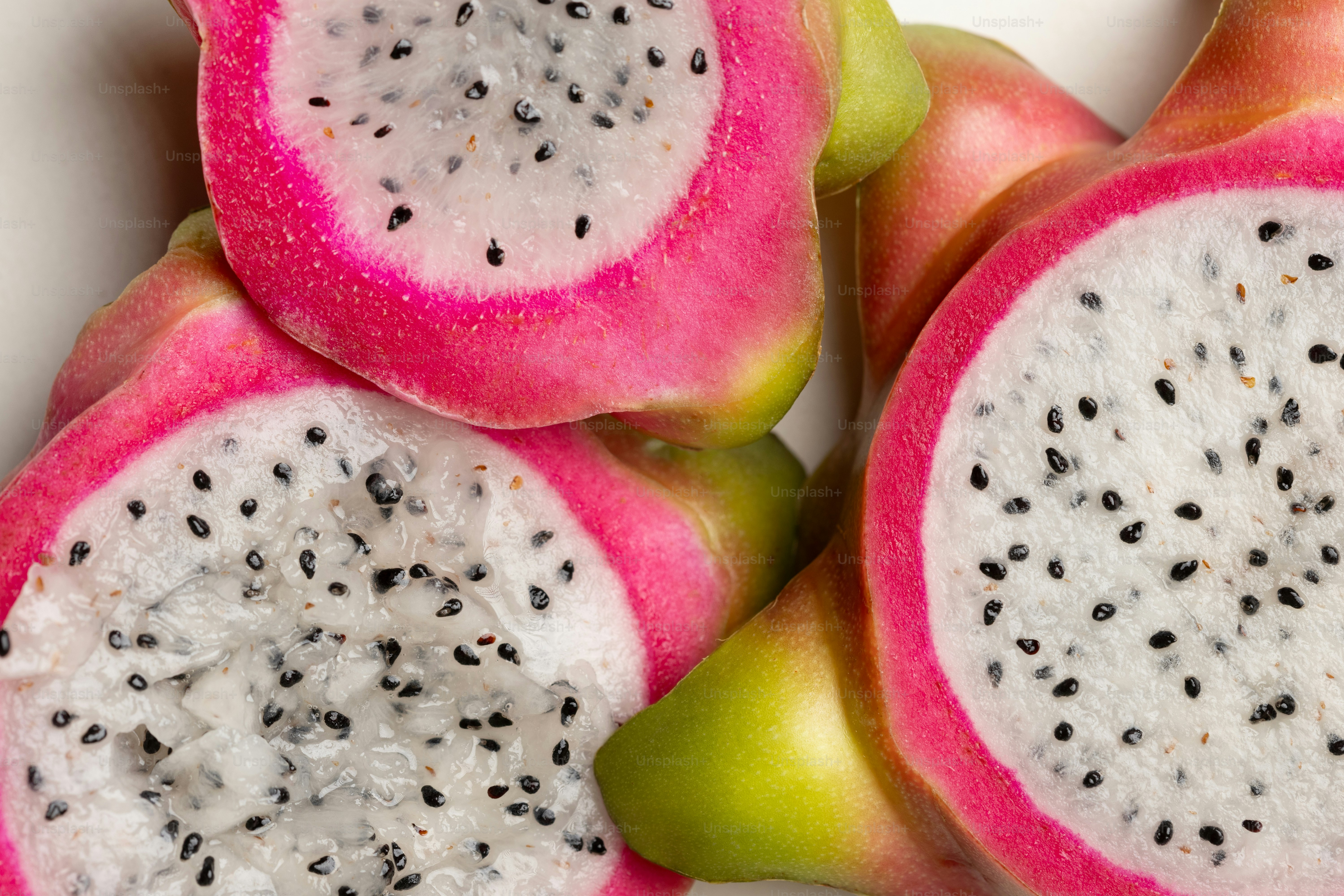 A close up of a dragon fruit cut in half