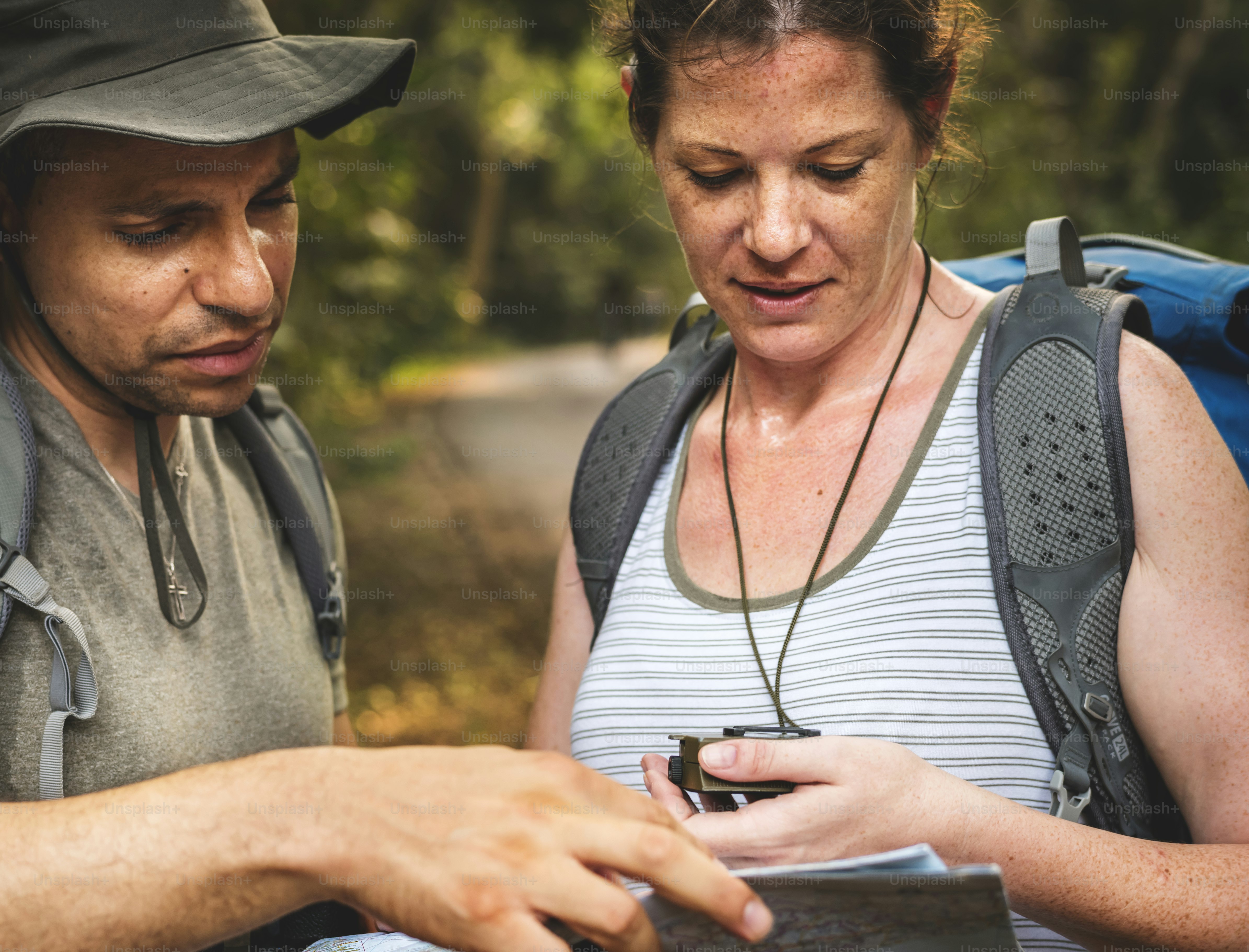 Checking on the map for directions photo – Forest Image on Unsplash