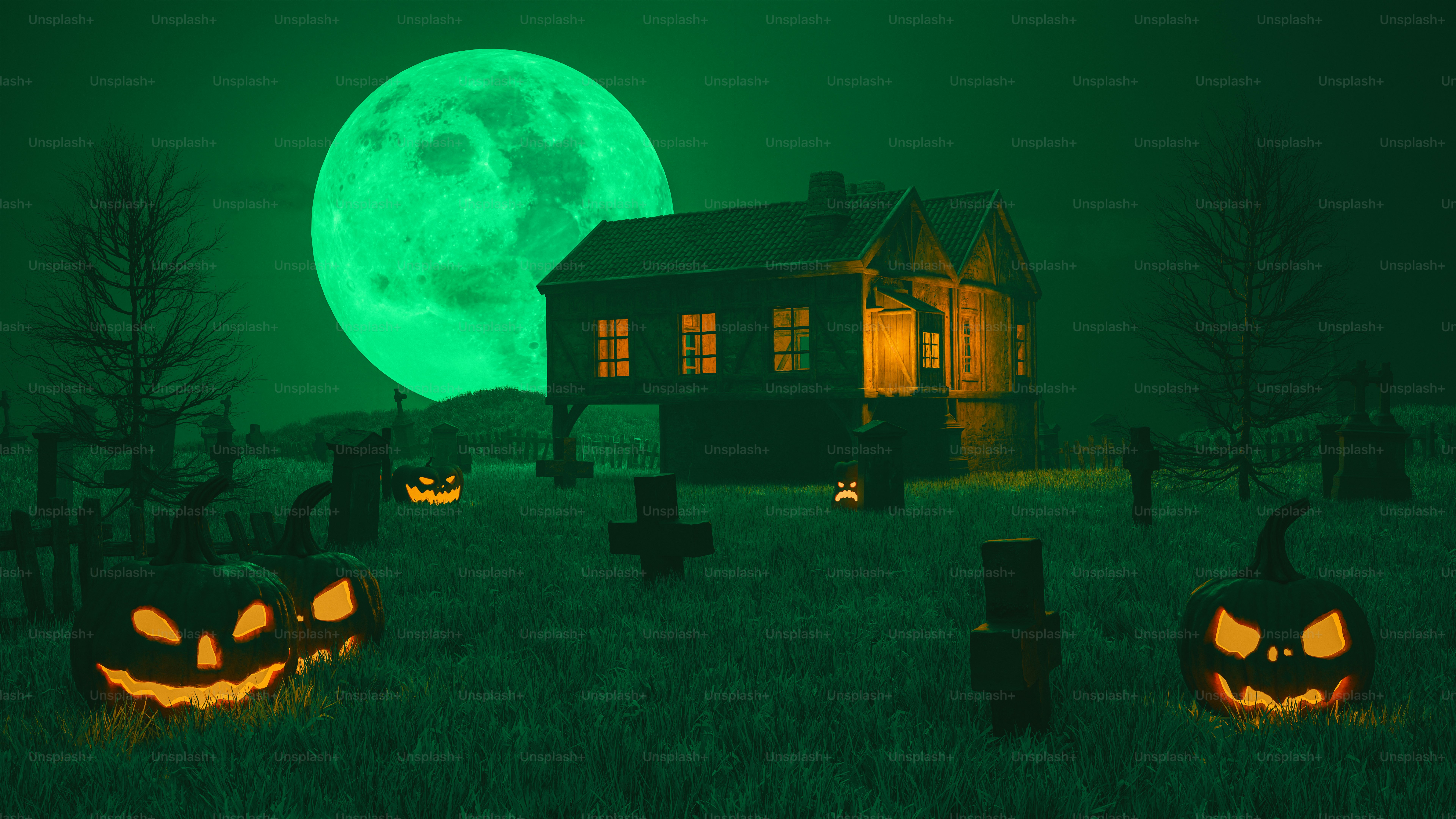 A group of carved pumpkins in front of a full moon