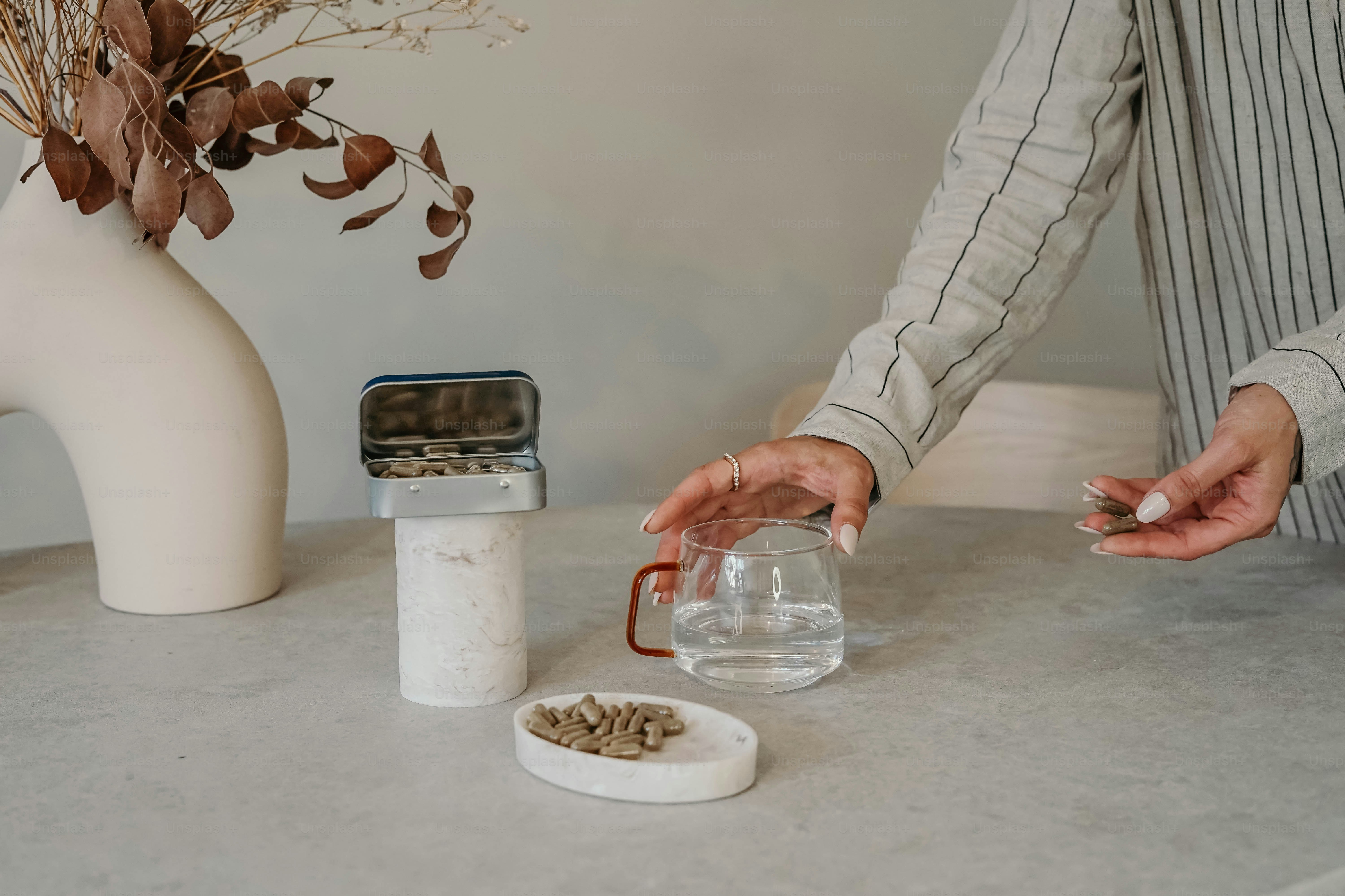 A man is pouring something into a glass