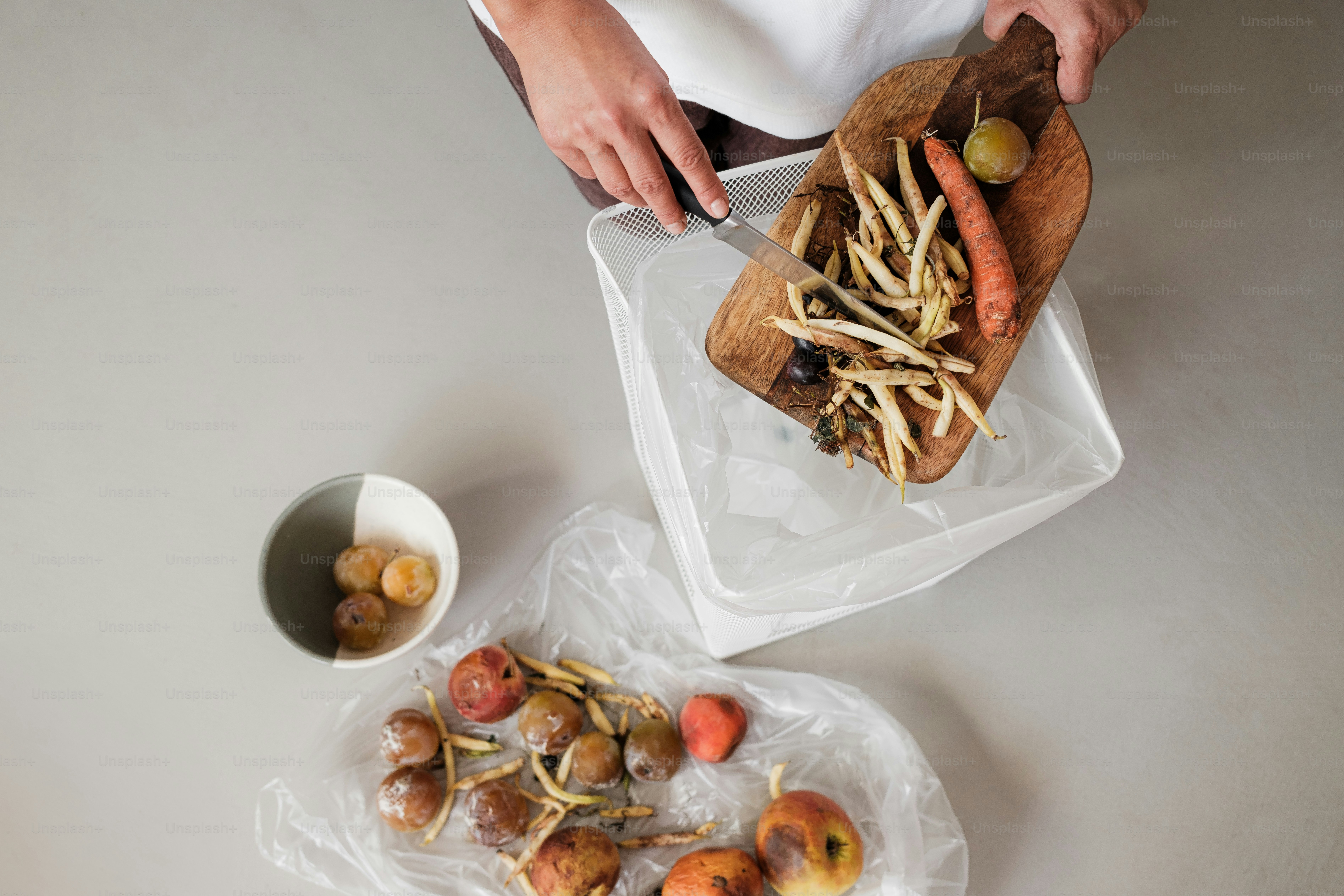 A woman is holding a tray of food