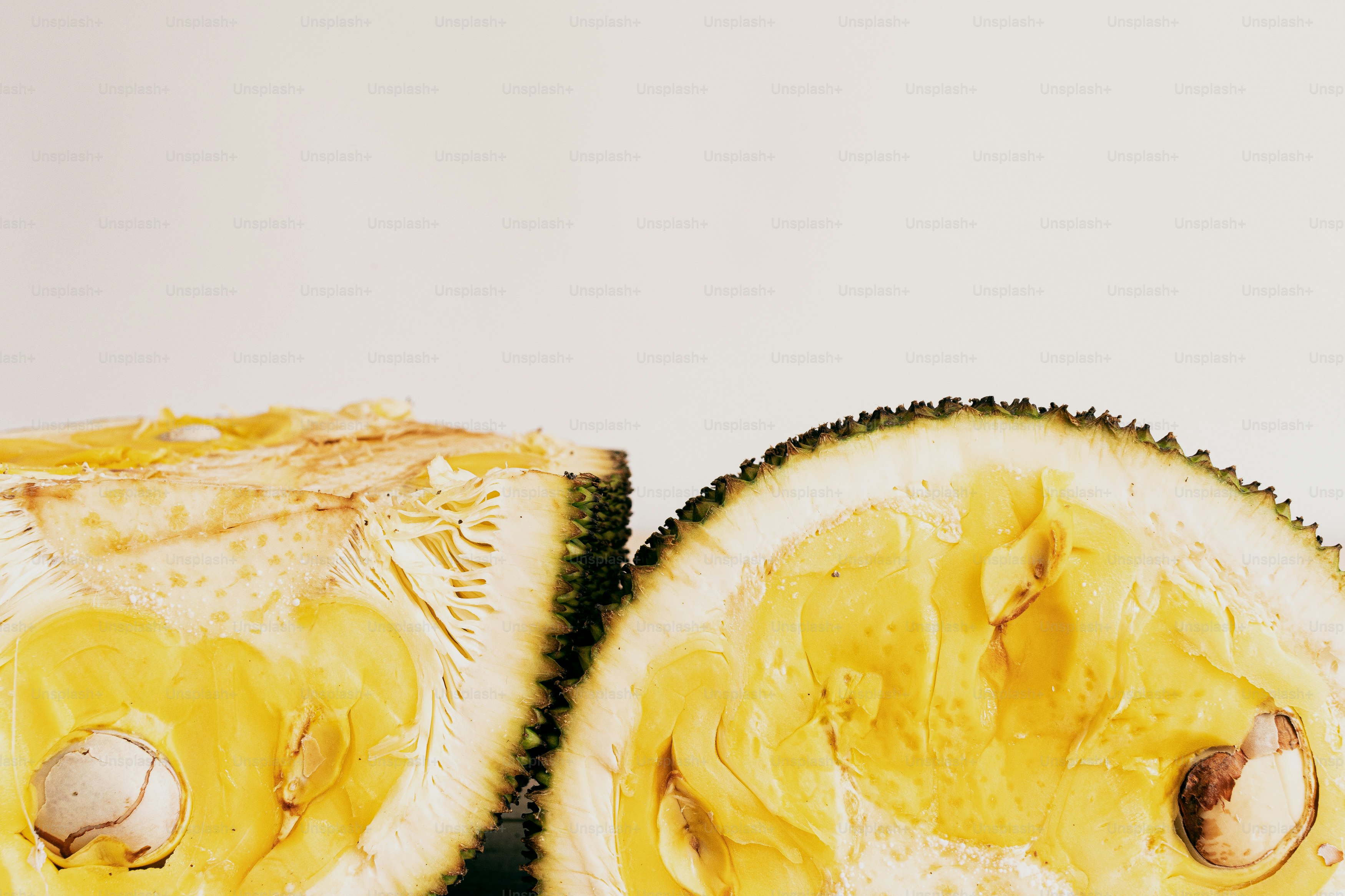 A cut in half fruit sitting on top of a table