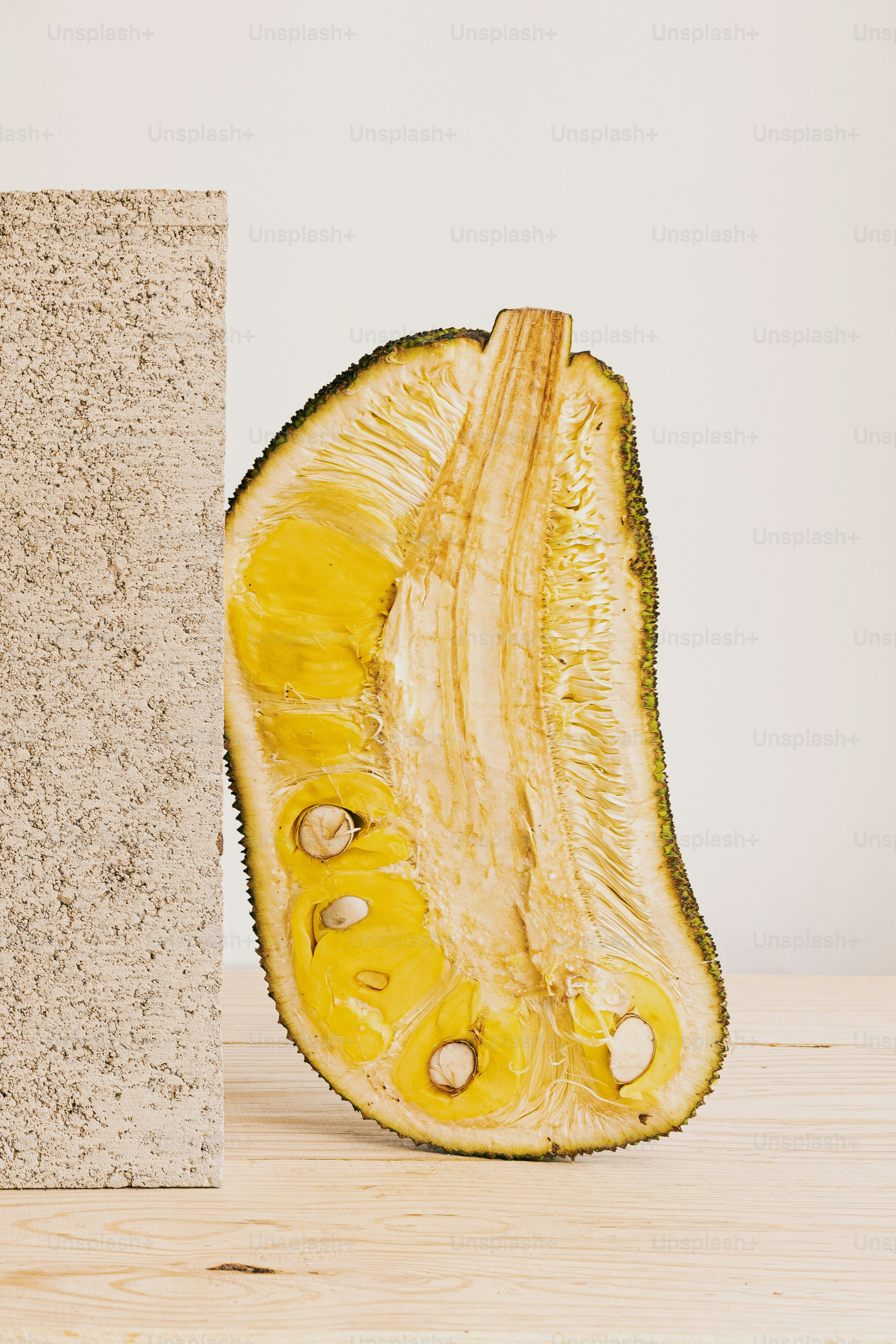A piece of fruit sitting on top of a wooden table