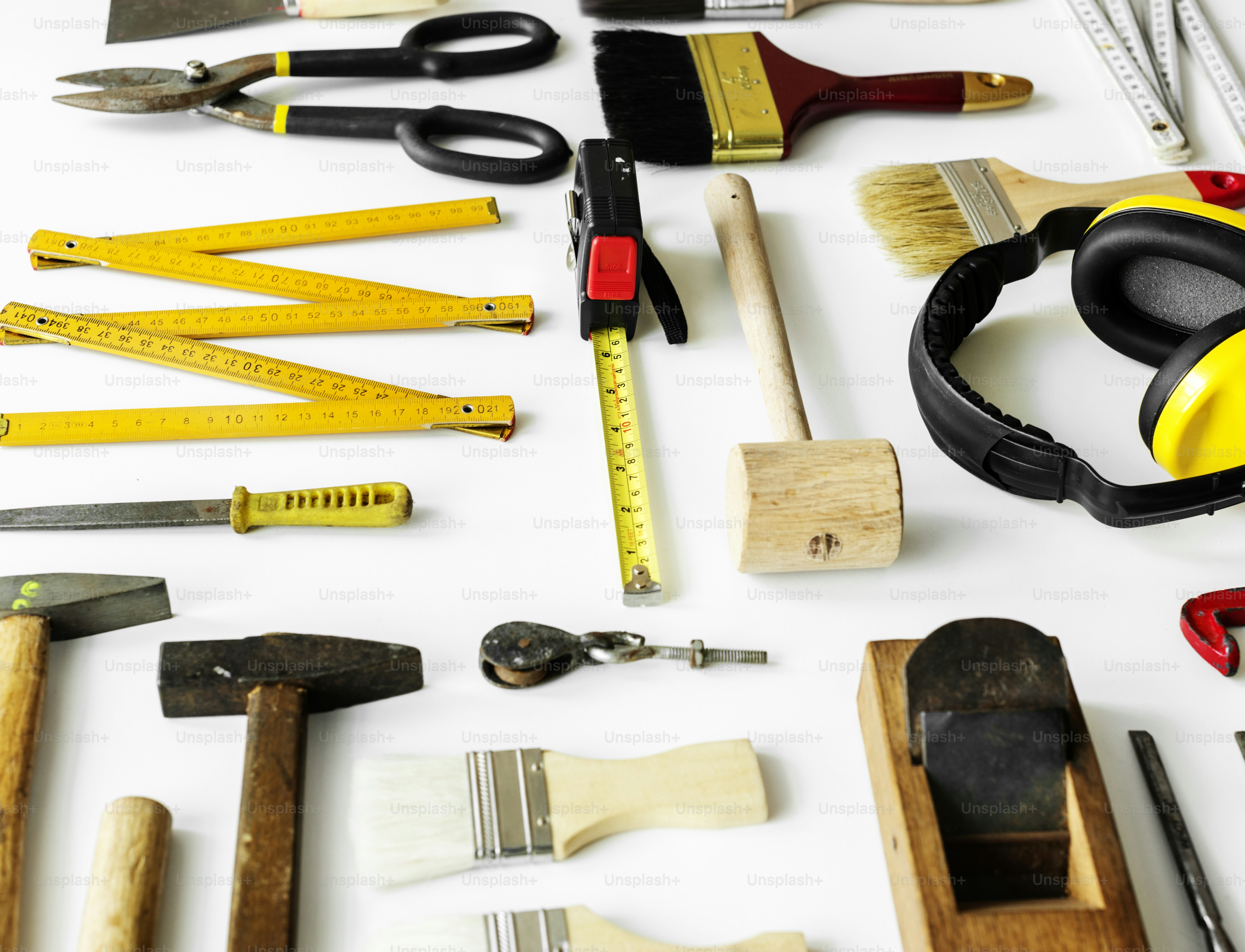 Flat lay of various technician tools isolated on white background