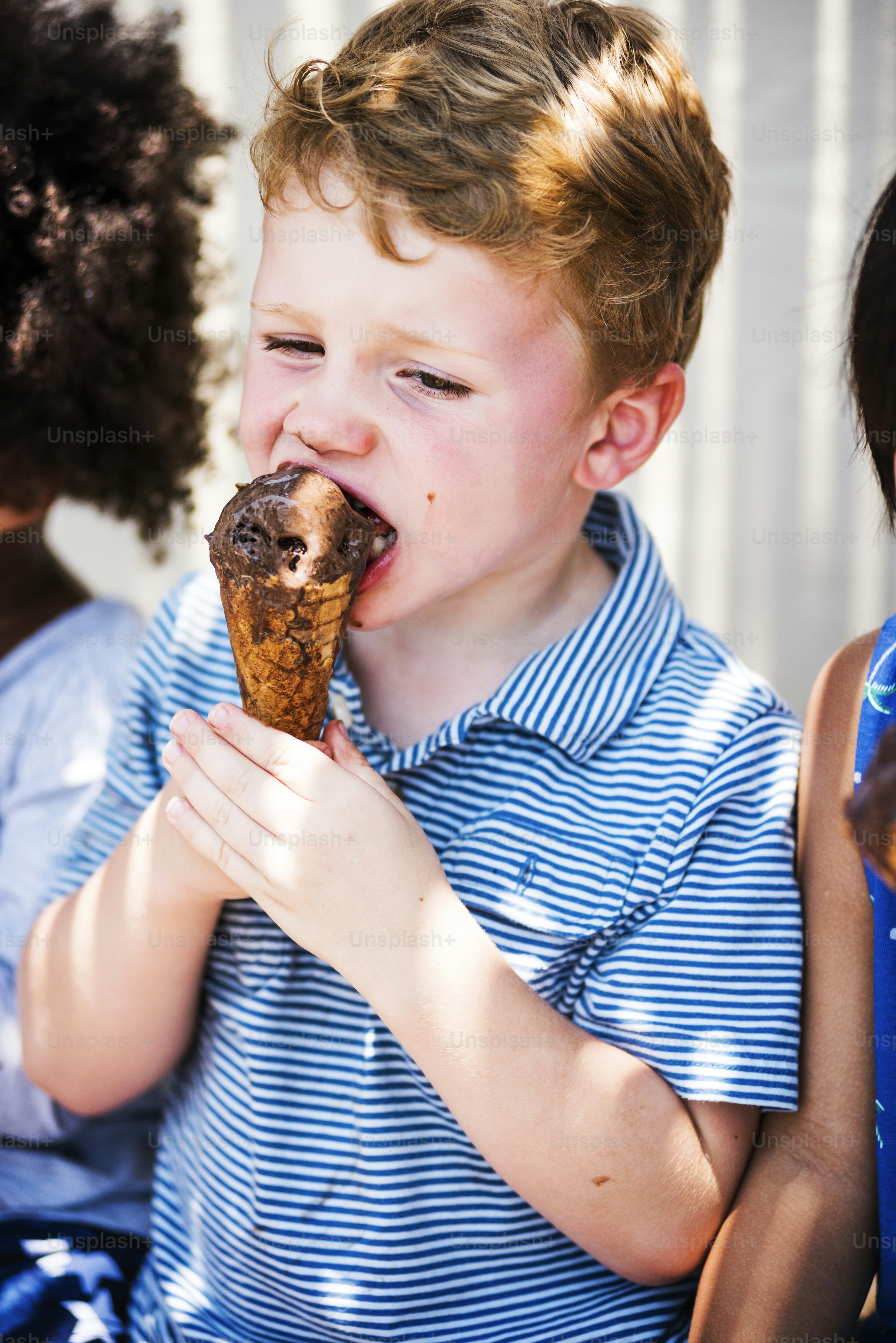 Cute kid having chocolate ice cream