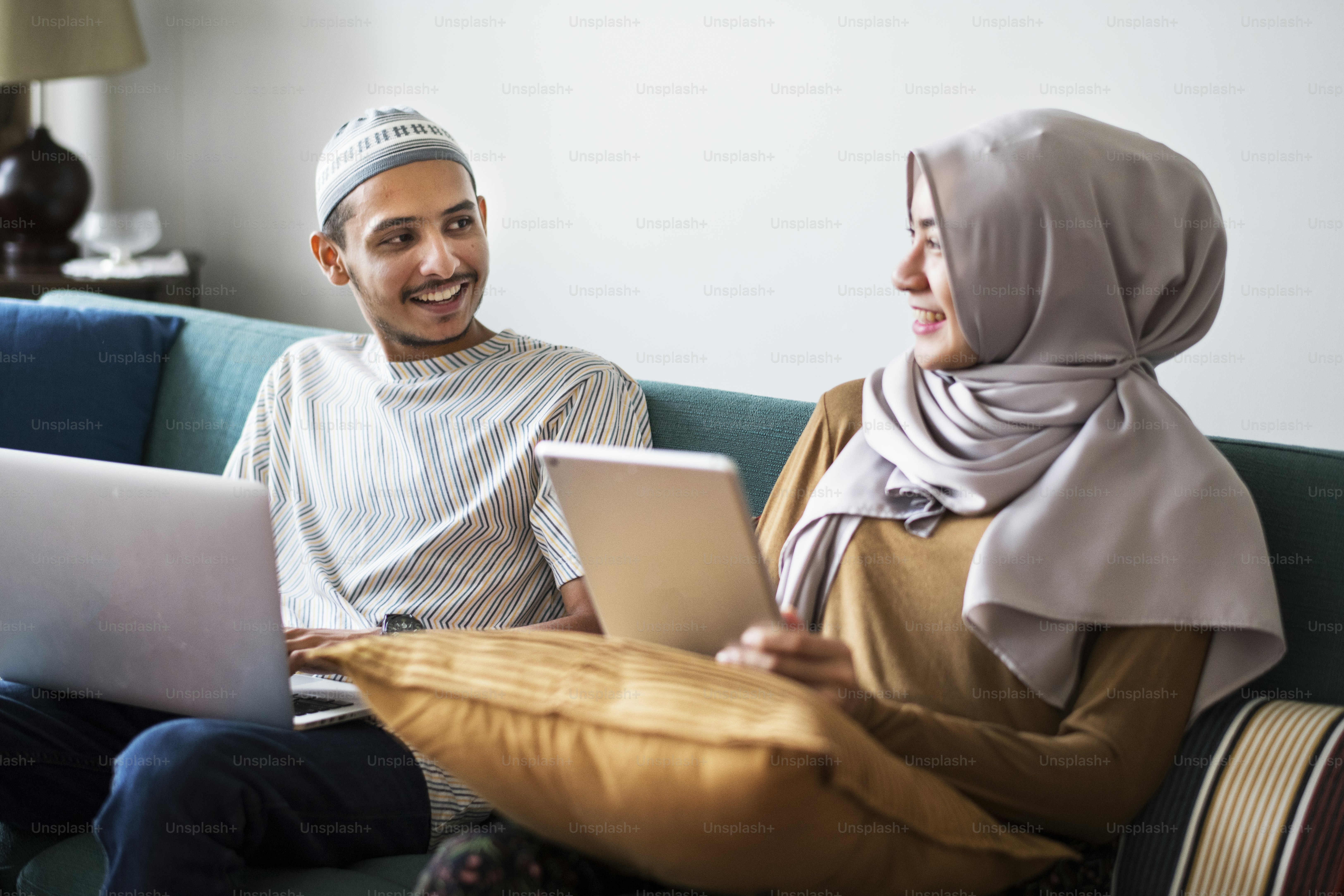 Muslim family using digital devices at home