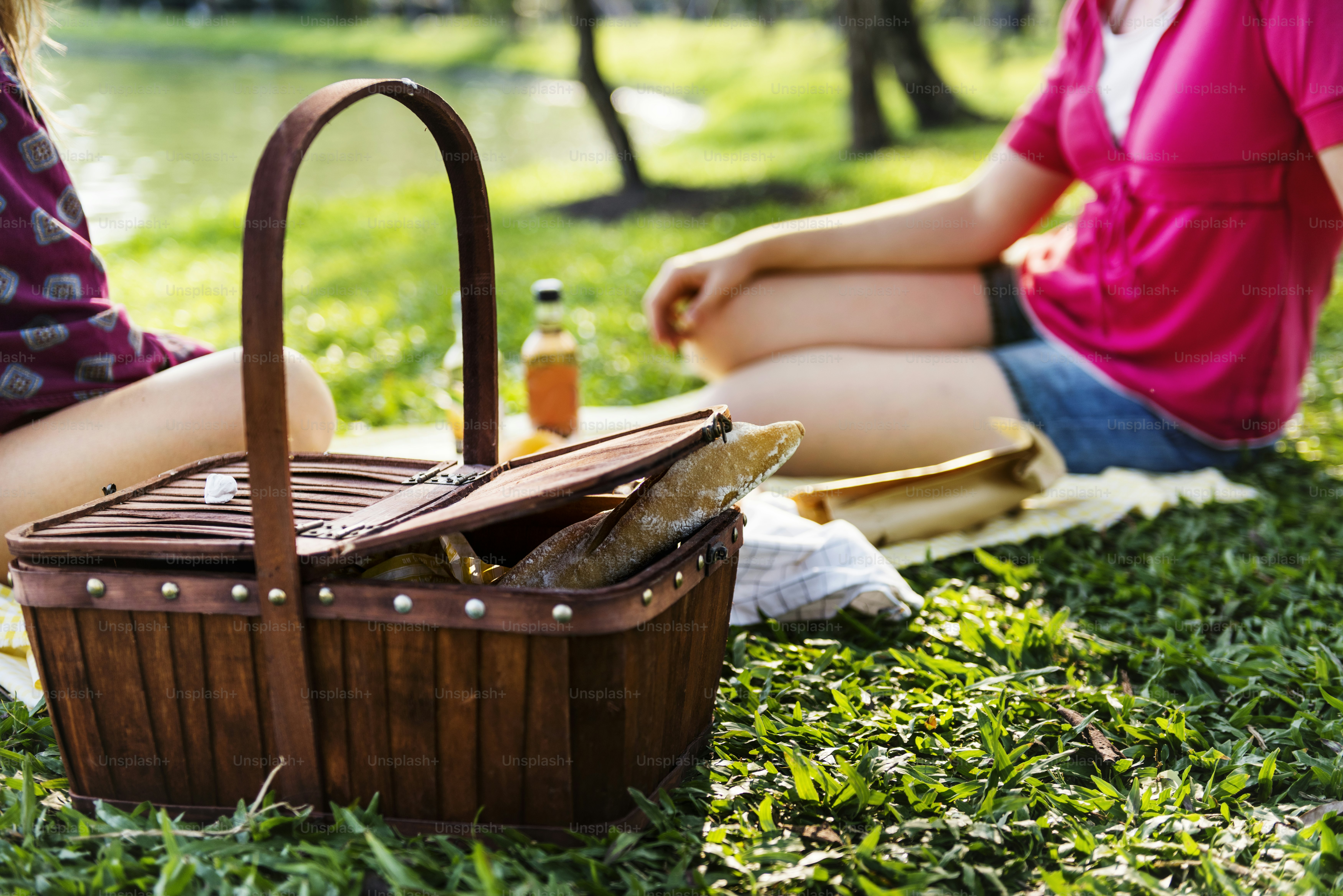 Mother and daughter having a picnic in the park